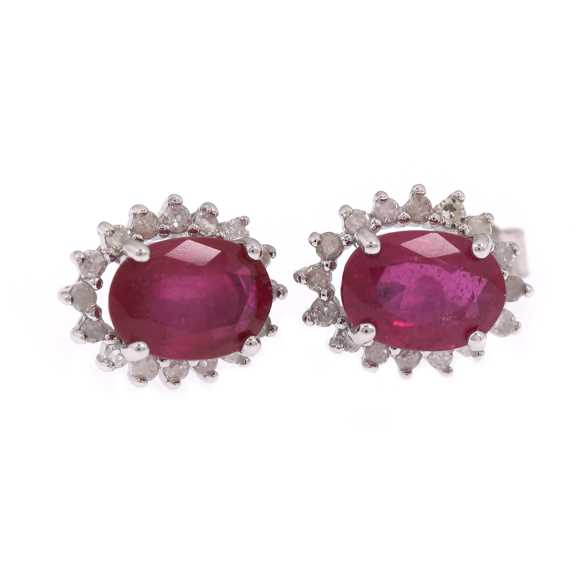 Pair of white gold earrings, decorated with rubies and diamonds