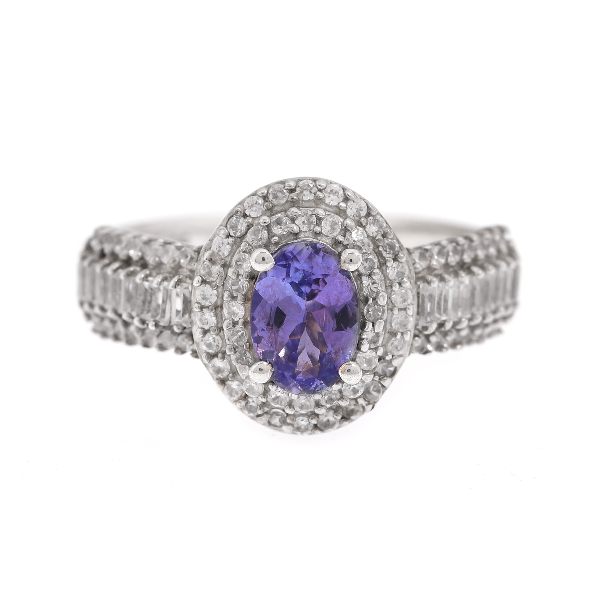 Gilded silver ring, decorated with tanzanite surrounded by topazes
