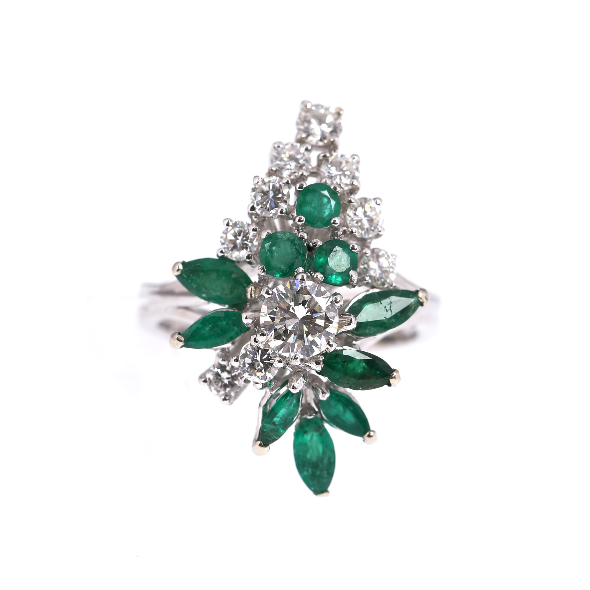 White gold ring, decorated with emeralds and diamonds