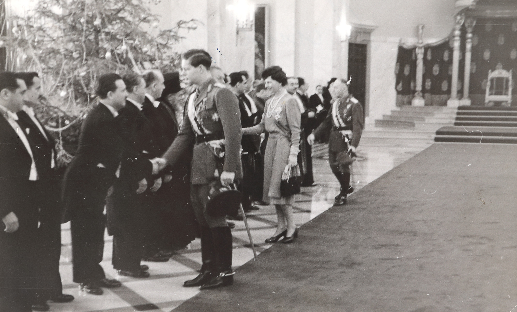 Photograph illustrating King Michael, Queen Mother Helen and Marshall Antonescu on New Year's Eve at the Royal Palace, 1942