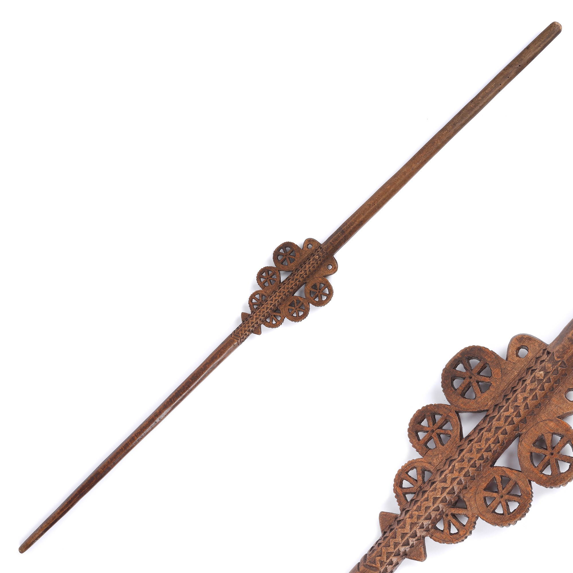 Wooden distaff, traced with solar symbols and wolf fangs, Apuseni, 19th century, comes from the collection of Iulia Gorneanu