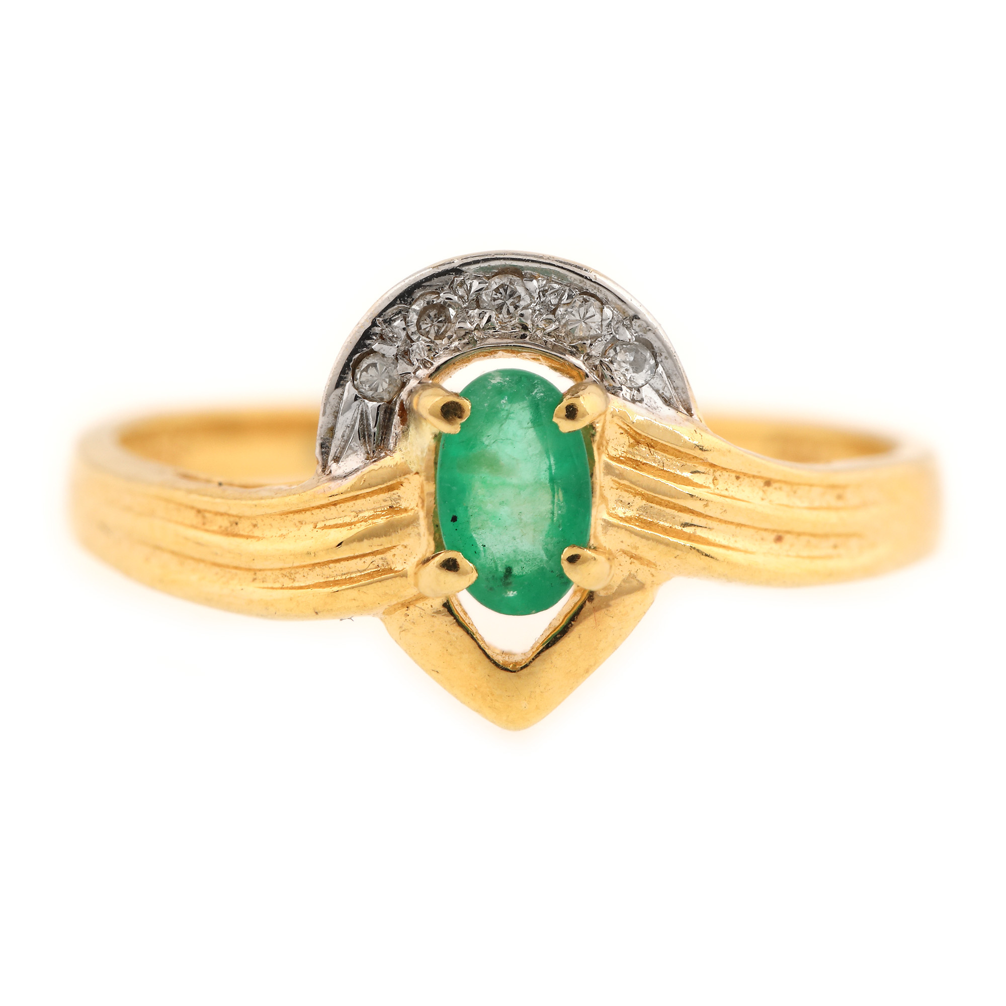 Two colour gold ring, decorated with emerald and diamonds