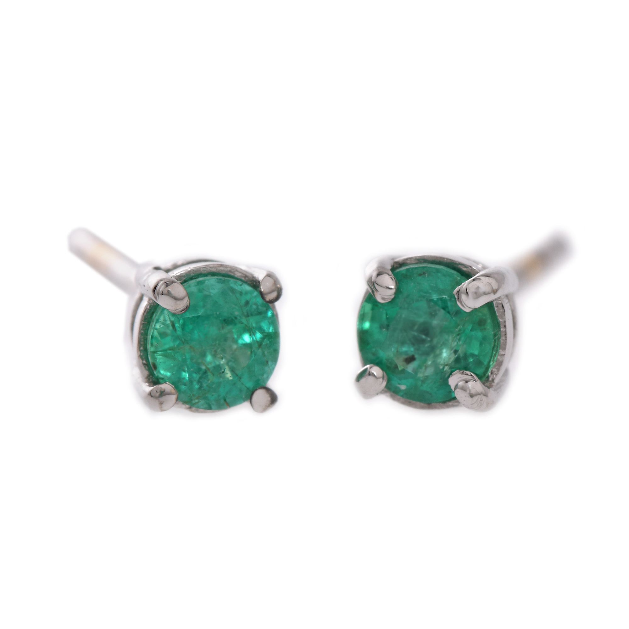 Pair of white gold earrings, decorated with emeralds