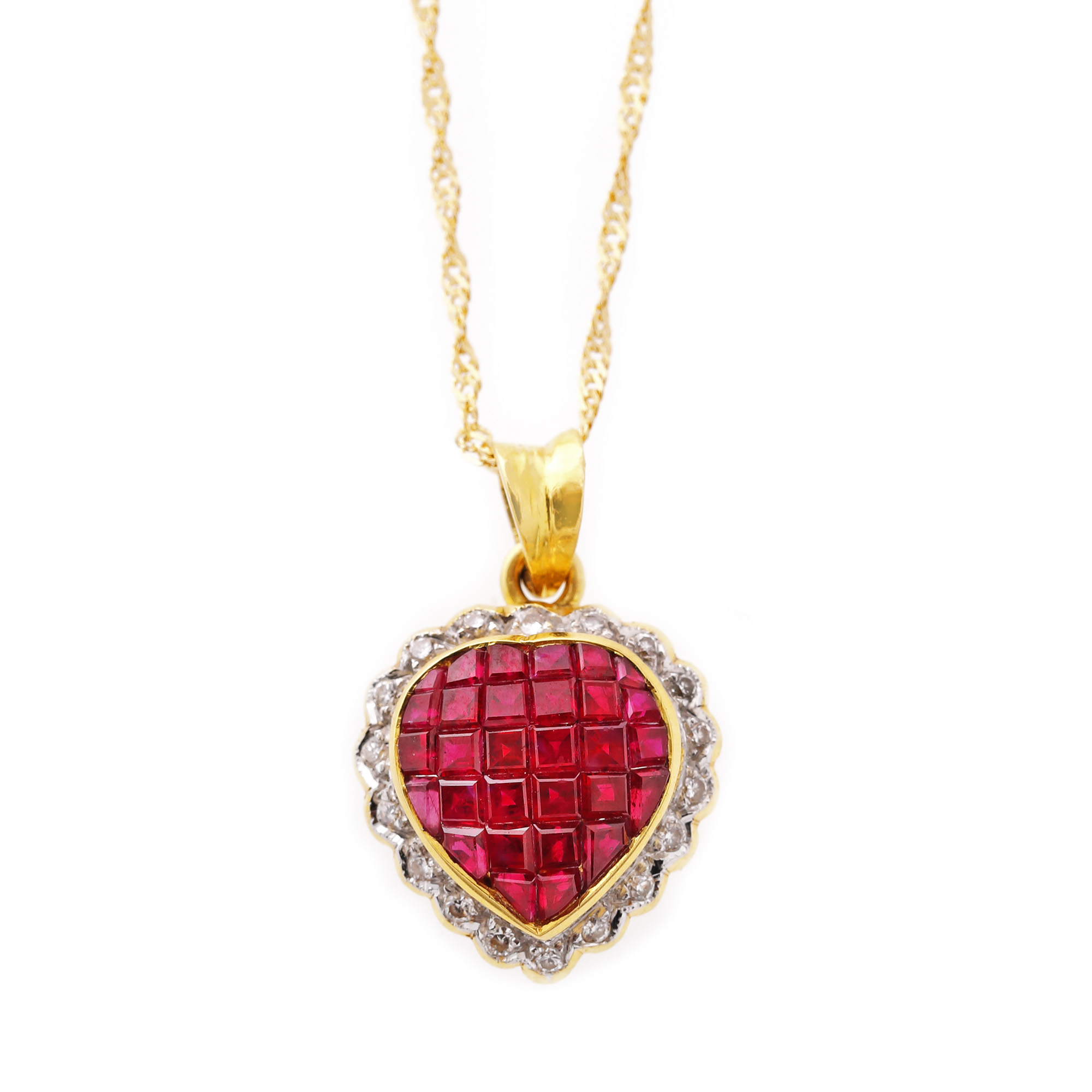 Gold necklace with heart-shaped pendant, decorated with rubies and diamonds