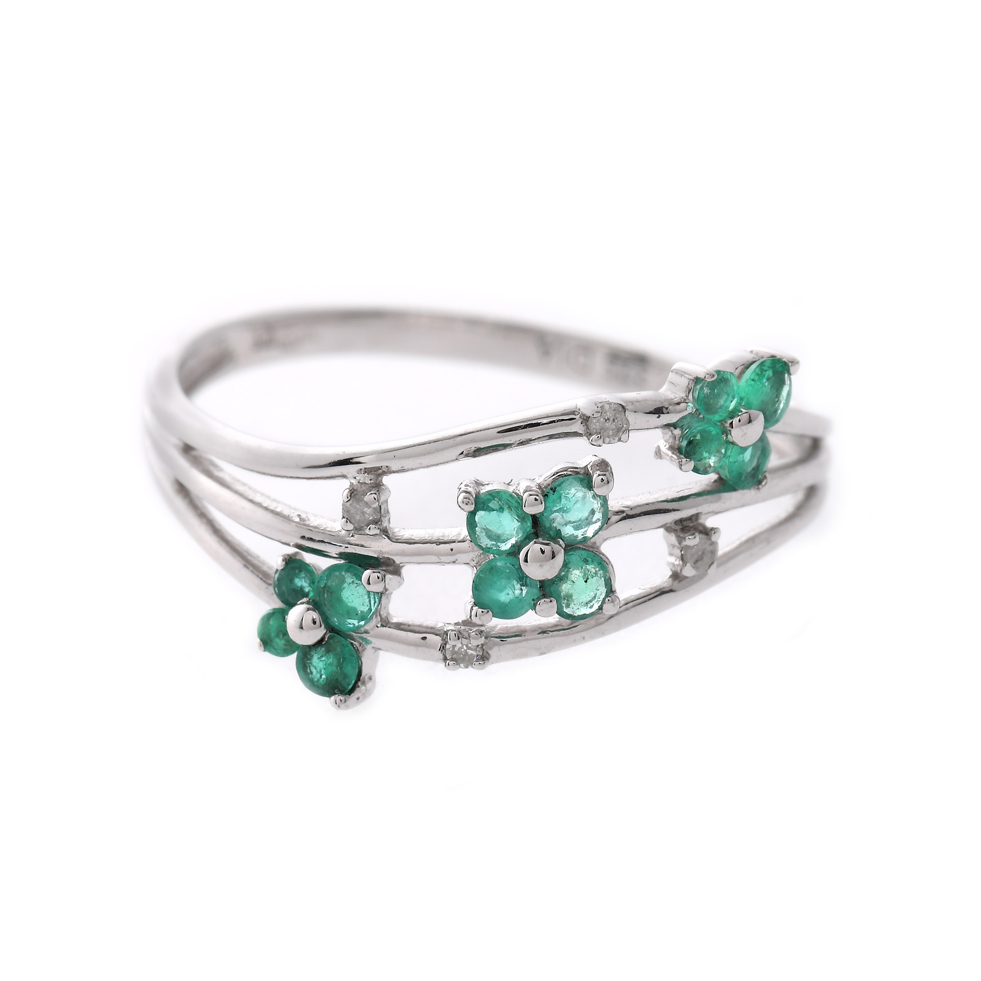 White gold ring, decorated with emeralds and diamonds