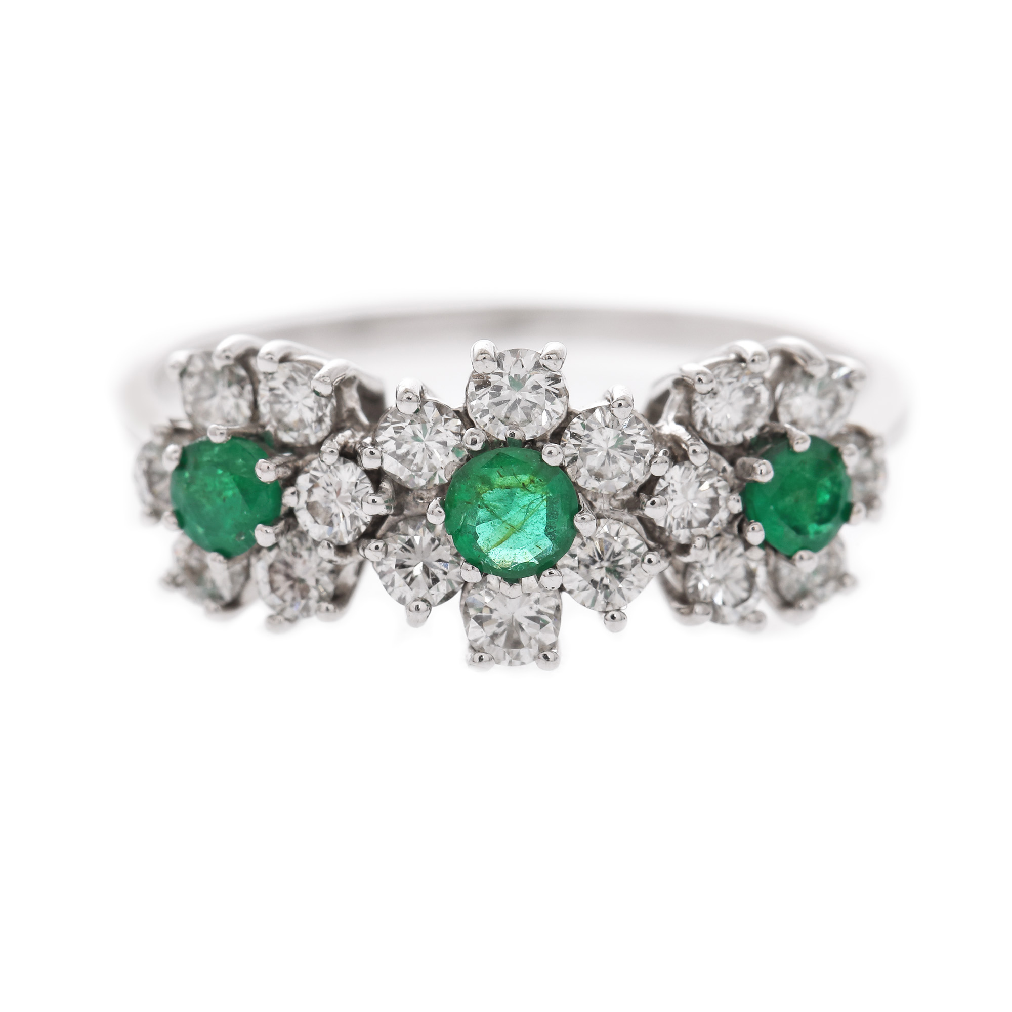 White gold ring, decorated with emeralds and diamonds