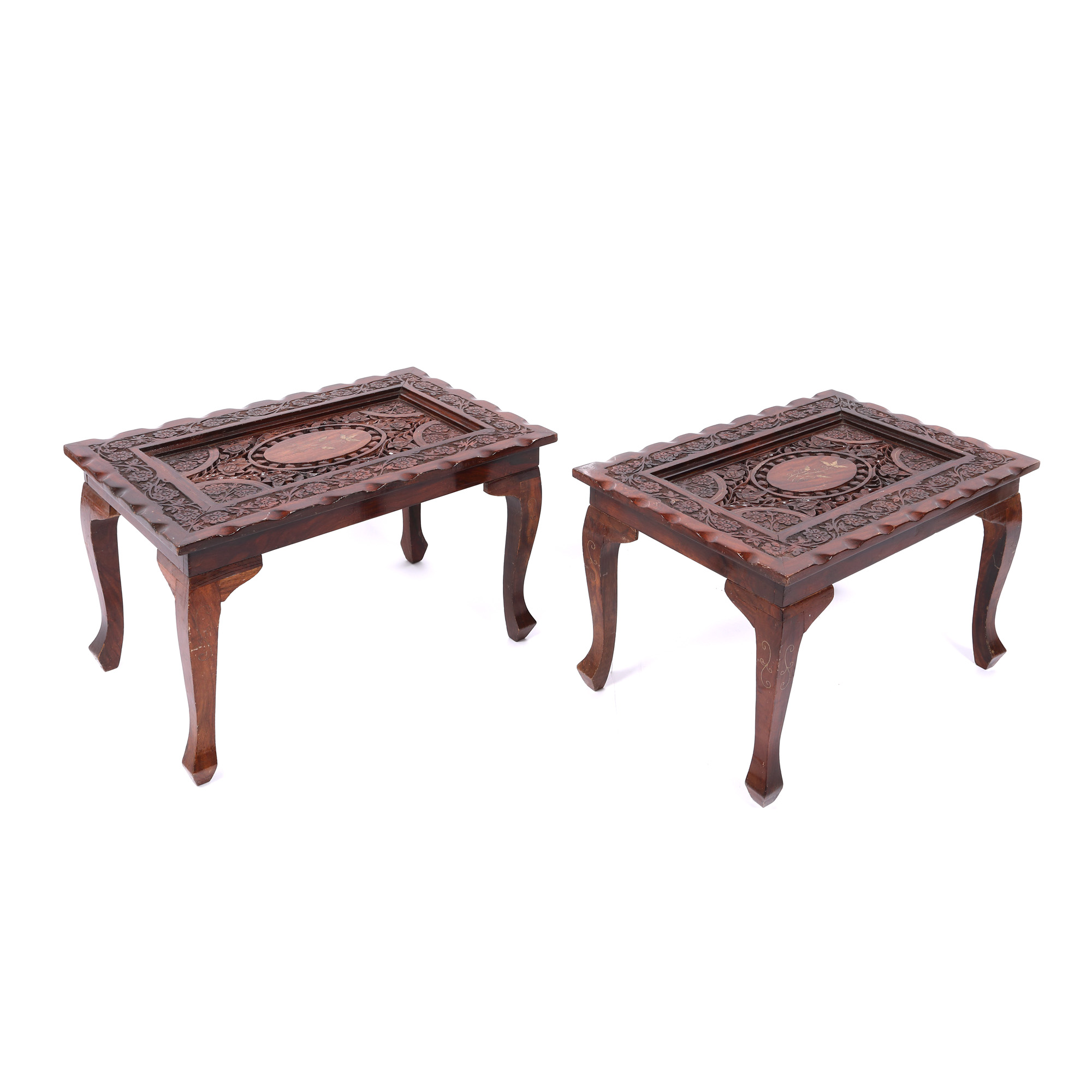Pair of carved rosewood tables decorated with floral motifs