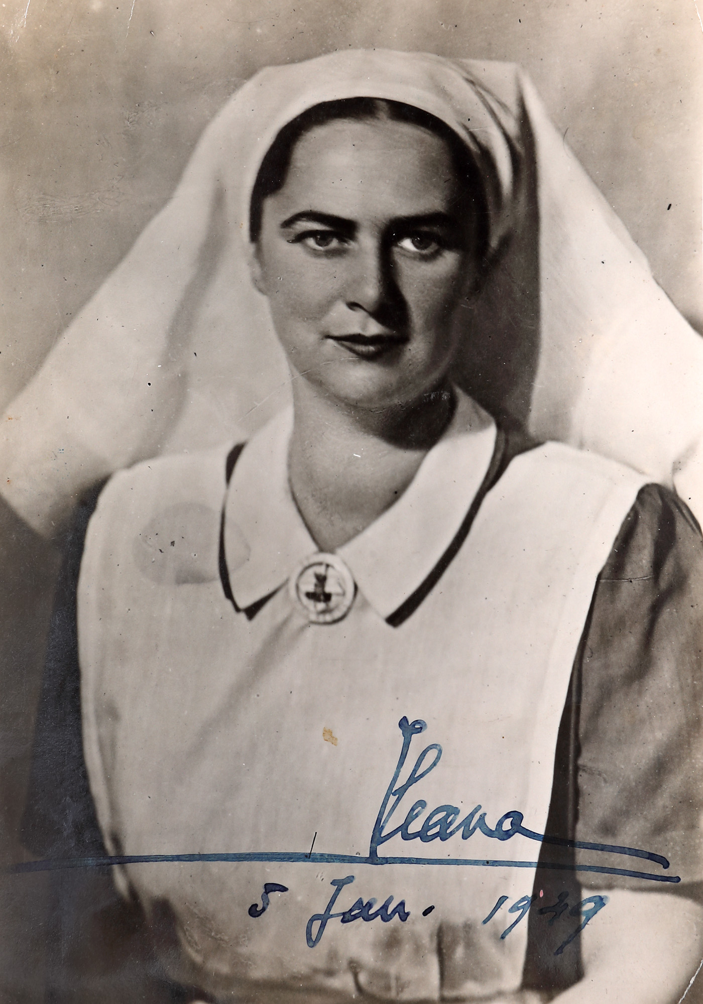 Photograph of Princess Ileana, in the uniform of a charity nurse, dated 5 January 1949, with her handwritten signature