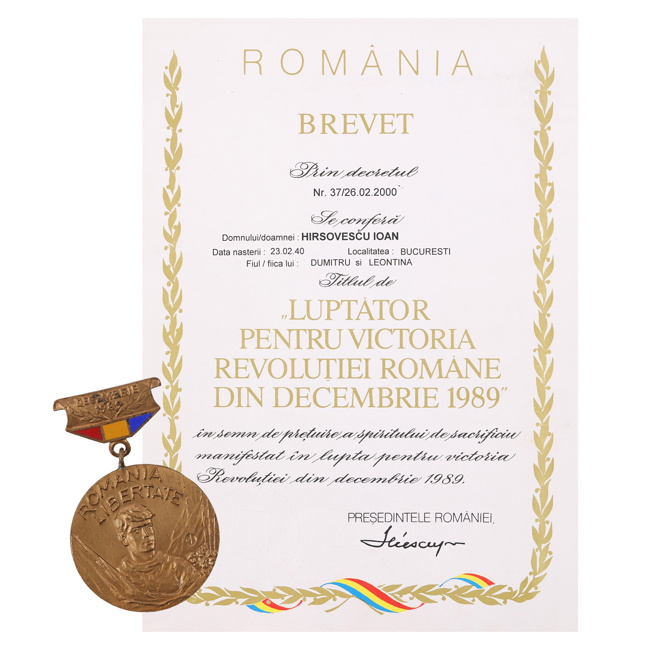 The decoration "Fighter for the Victory of the Romanian Revolution of December 1989", together with a license
