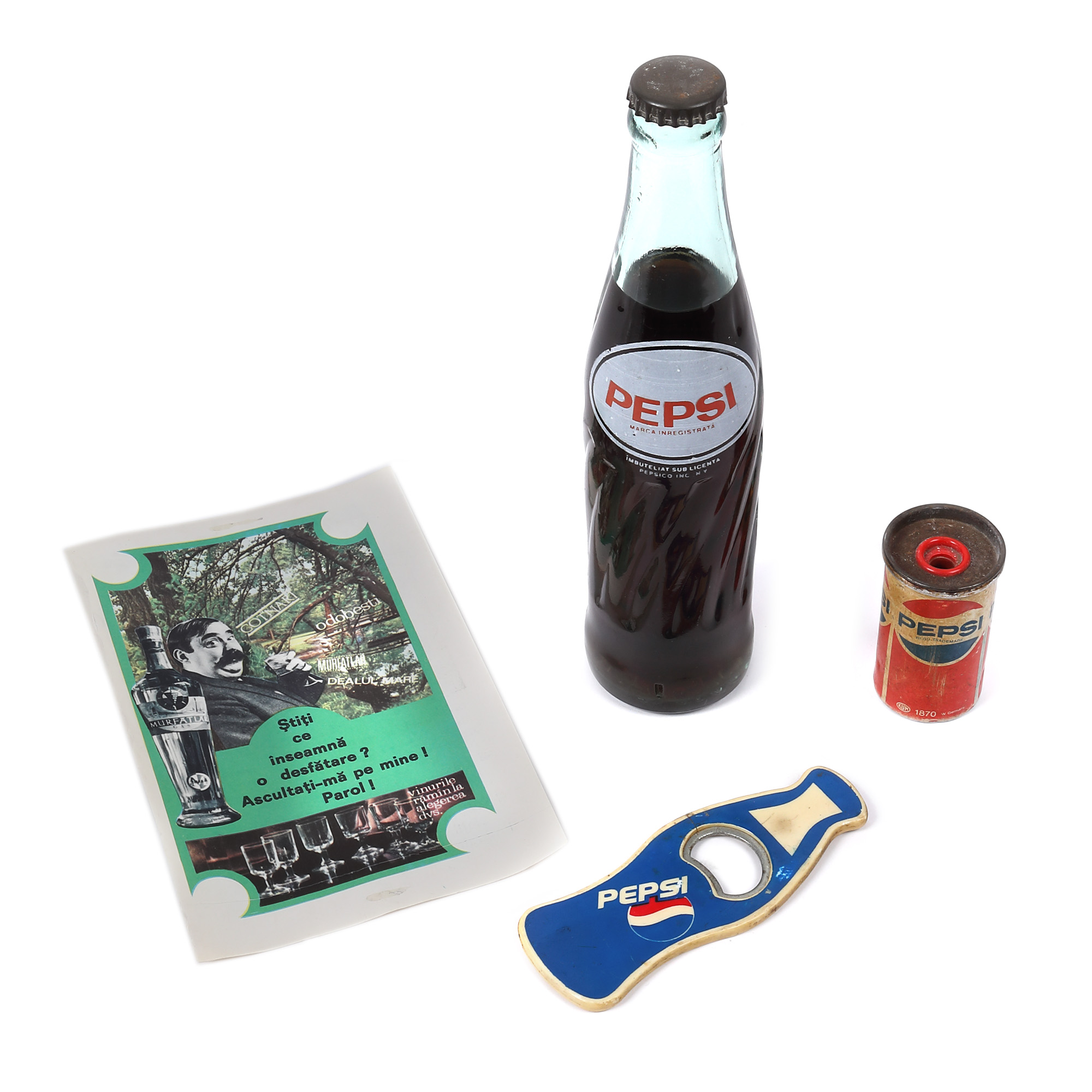 An unopened bottle of Pepsi-Cola, an advertisement, an opener and an advertising sharpener, circa 1975