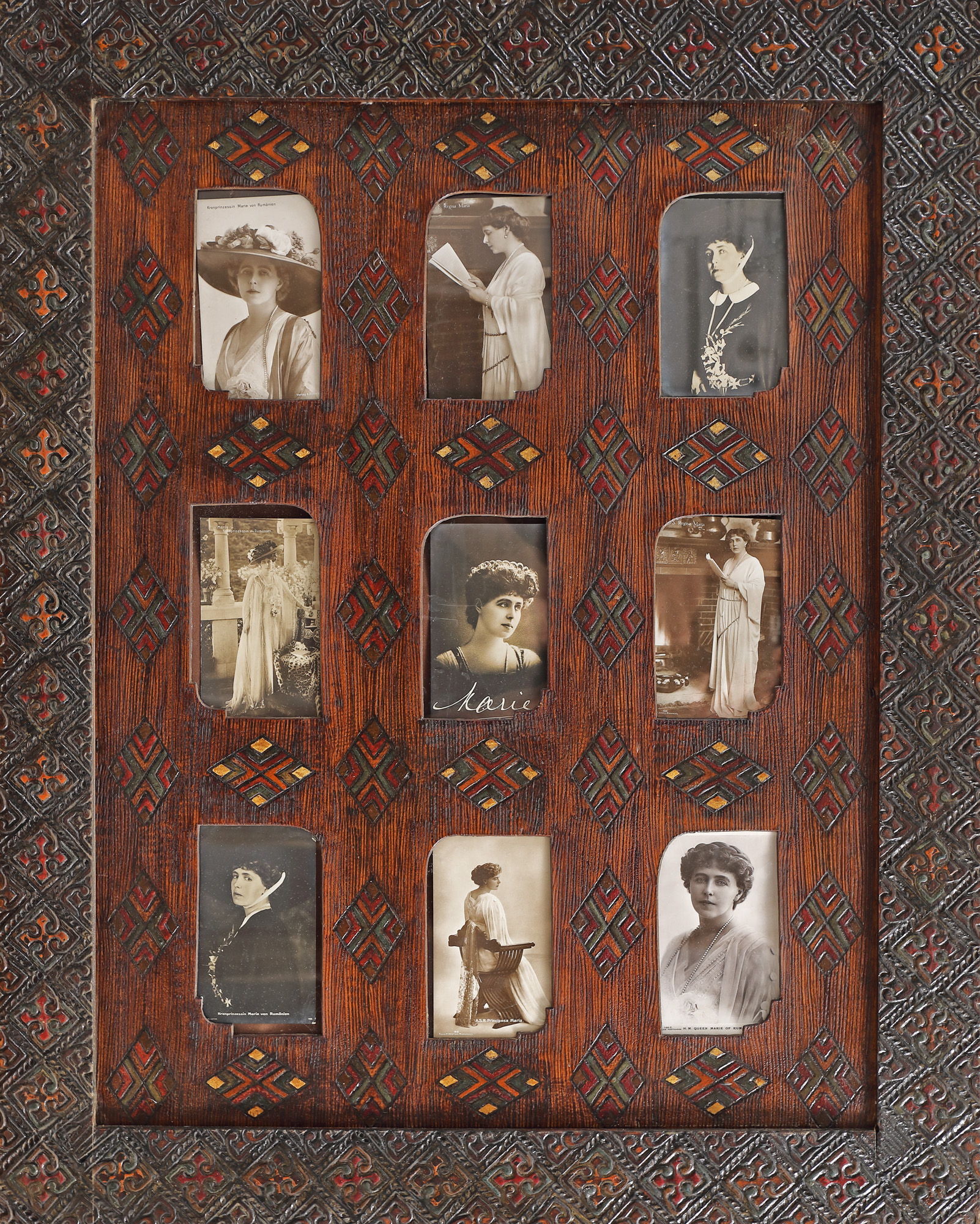 Nine postcards with pictures of Queen Mary, circa 1925, in a frame decorated in Neo-Romanian style, a special piece
