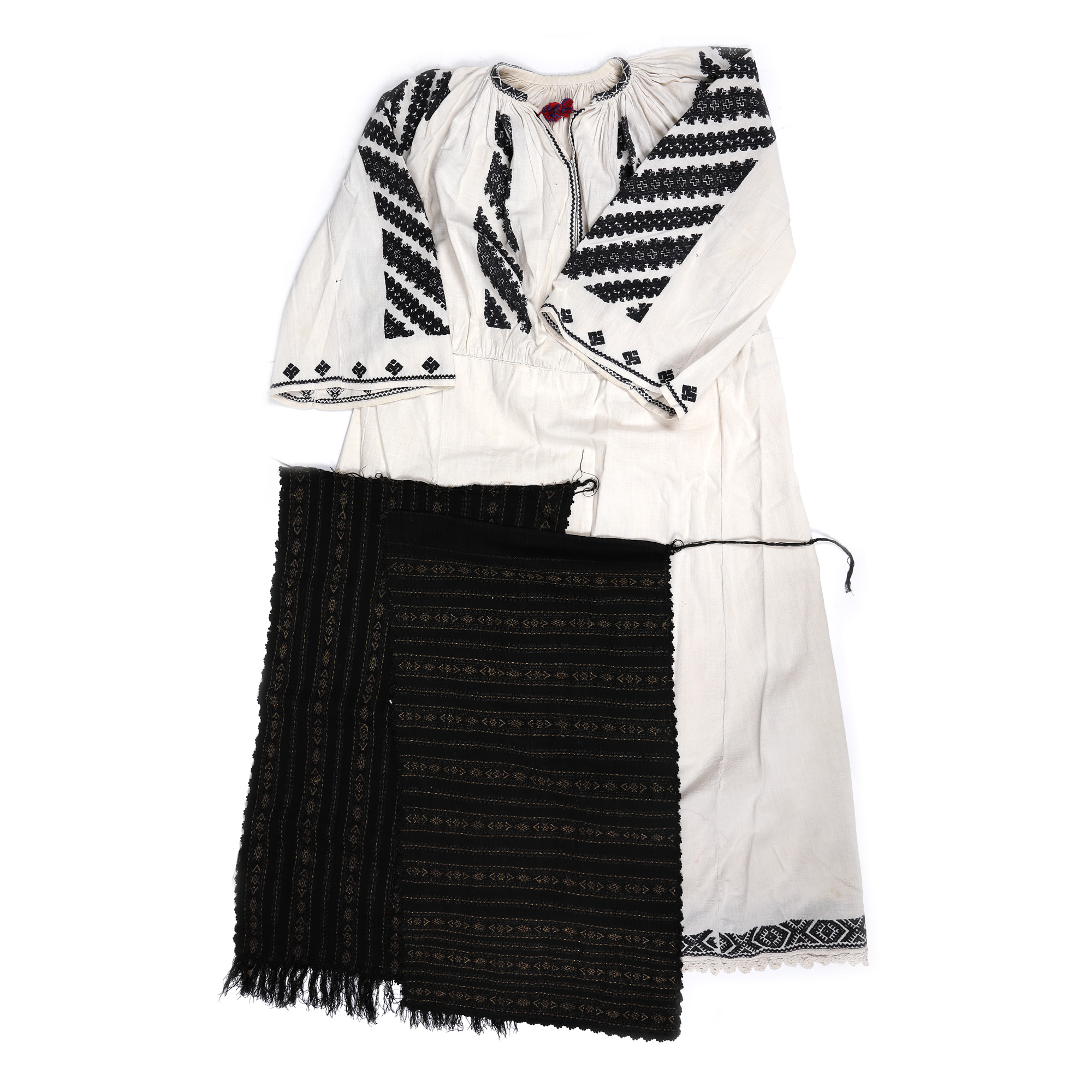 Folk costume consisting of a shirt sewn with anthropomorphic motifs on the sleeves and two aprons woven with metal thread, Tismana area, Gorj, first half of the 20th century
