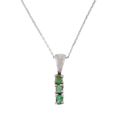 Silver necklace with pendant, decorated with emeralds