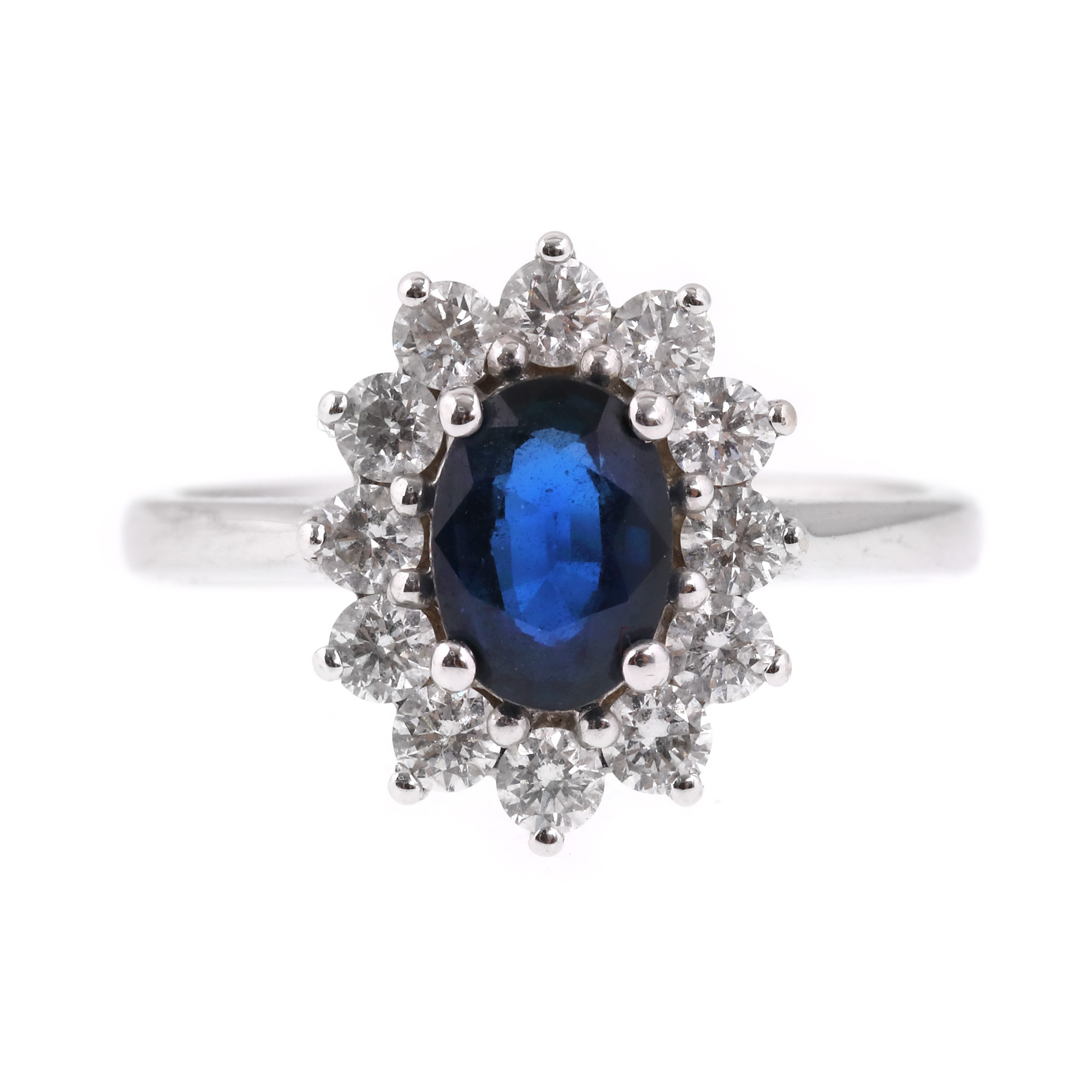 Inel din aur alb, decorat central cu safir anturat de diamante