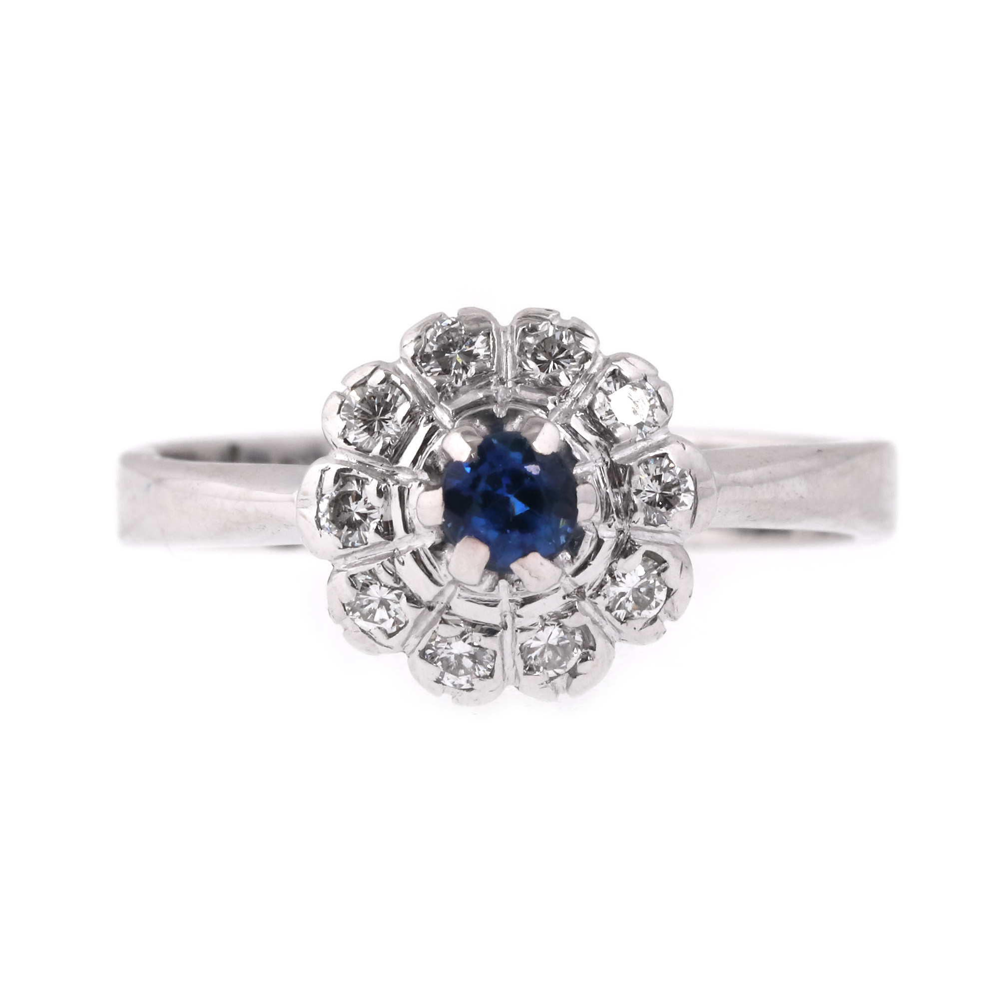 White gold ring, decorated with sapphire surrounded by diamonds