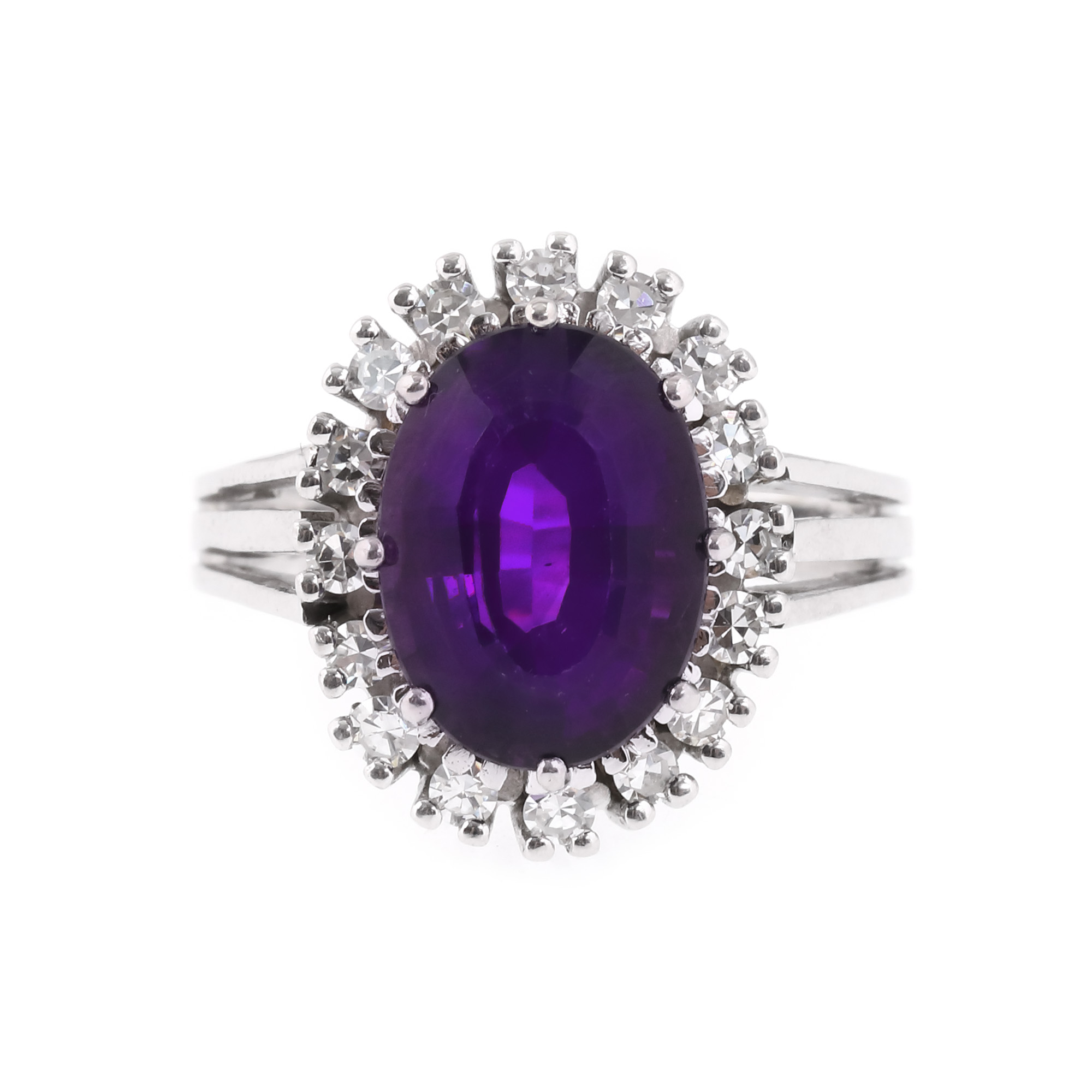 White gold ring, decorated with amethyst surrounded by diamonds