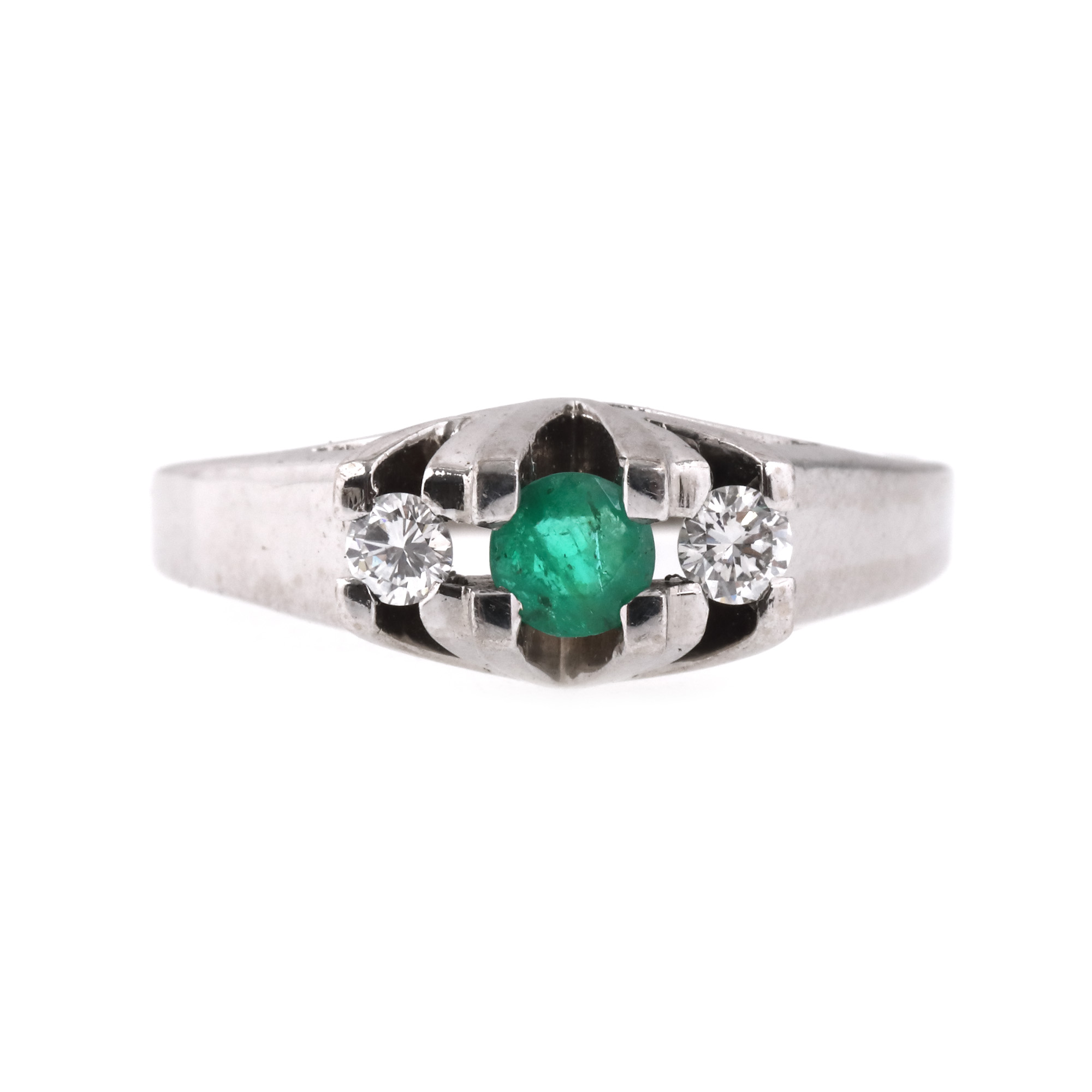 White gold ring, decorated with emeralds and diamonds