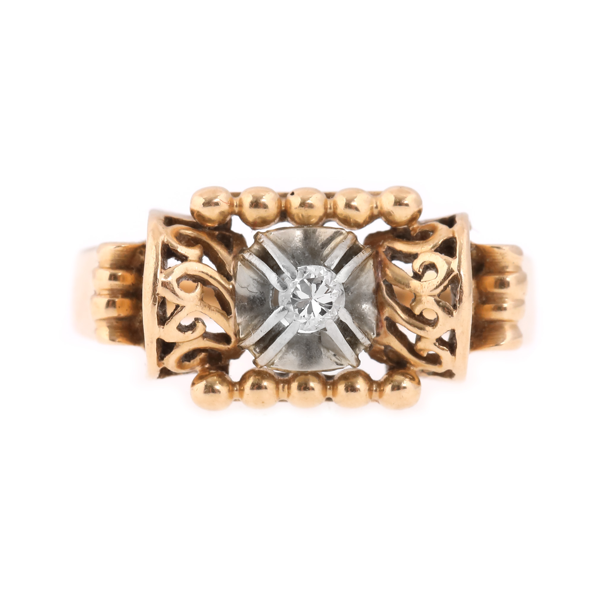 Two-tone gold ring, centrally decorated with a diamond, first half of the 20th century
