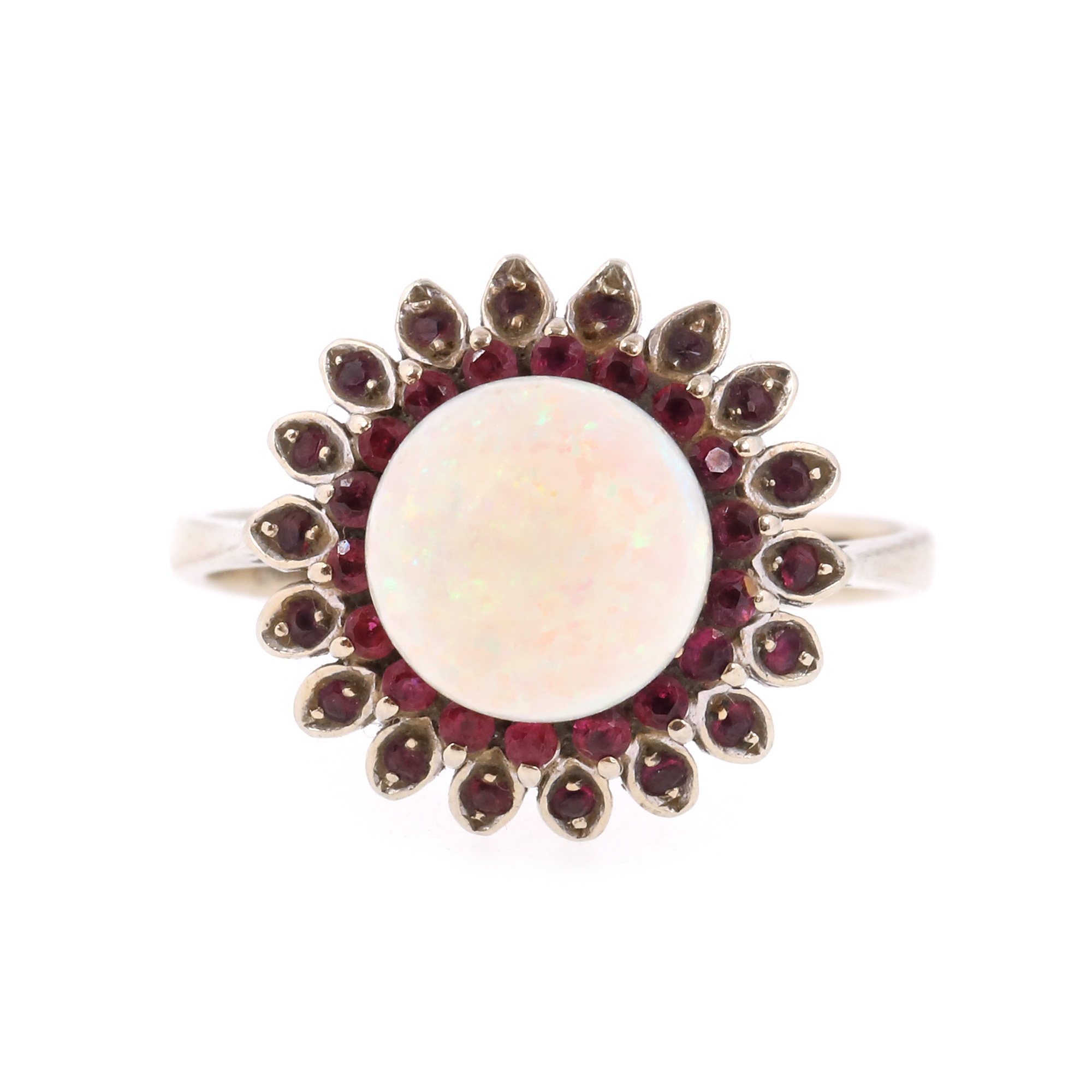White gold ring, centrally decorated with opal surrounded by rubies