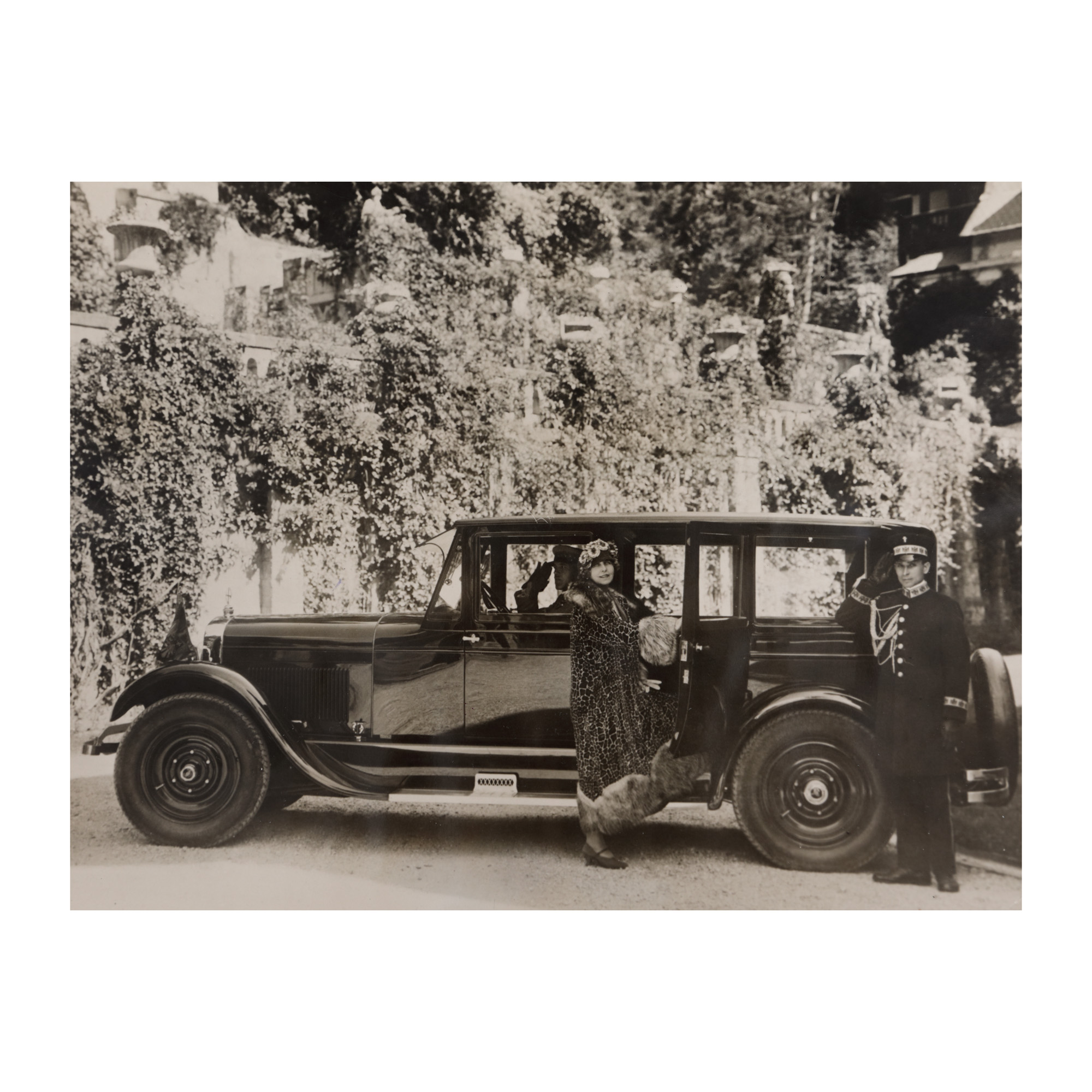 Press photograph depicting Queen Marie preparing to depart in the car of the Royal House, 1926 