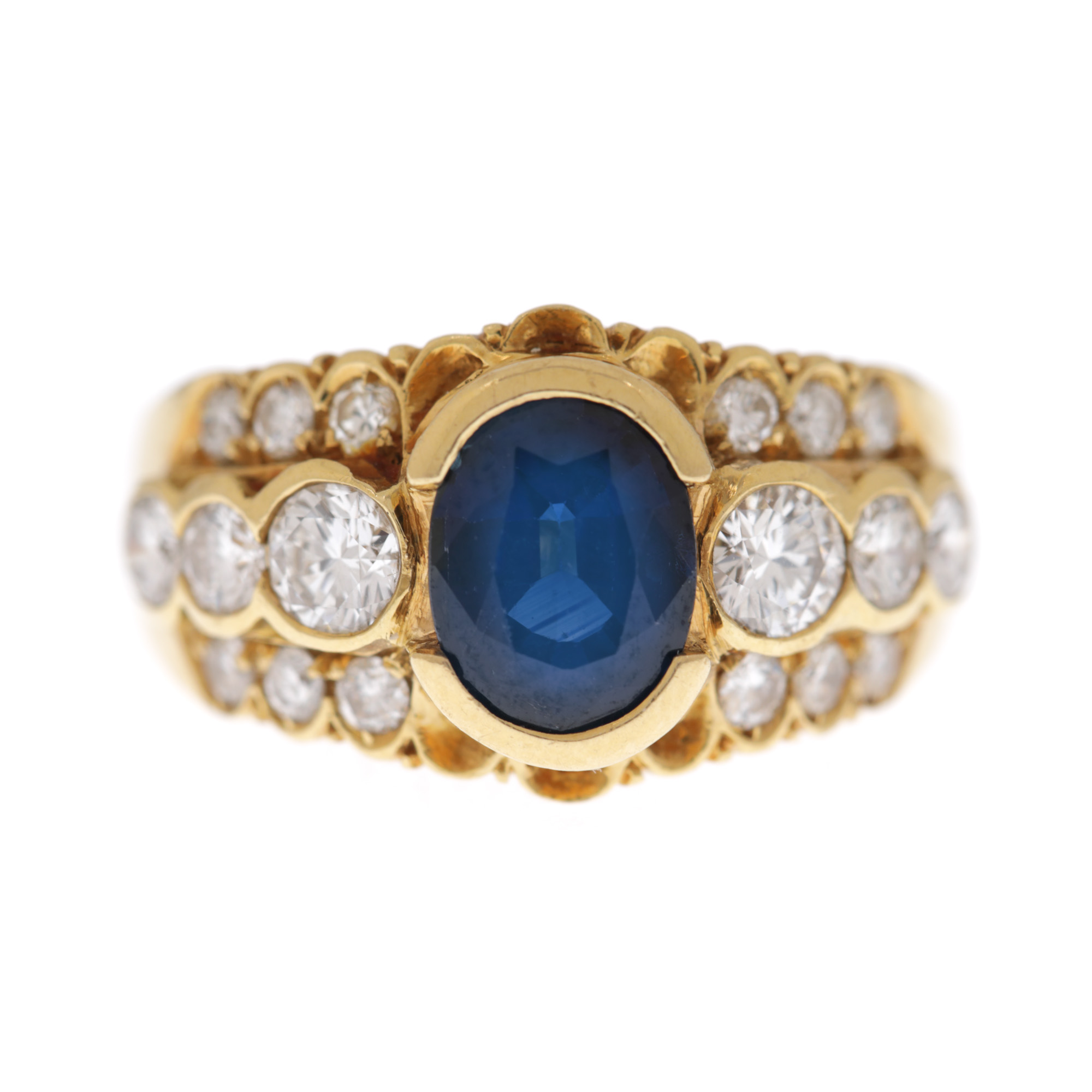 Gold ring, decorated with central sapphire surrounded by diamonds 