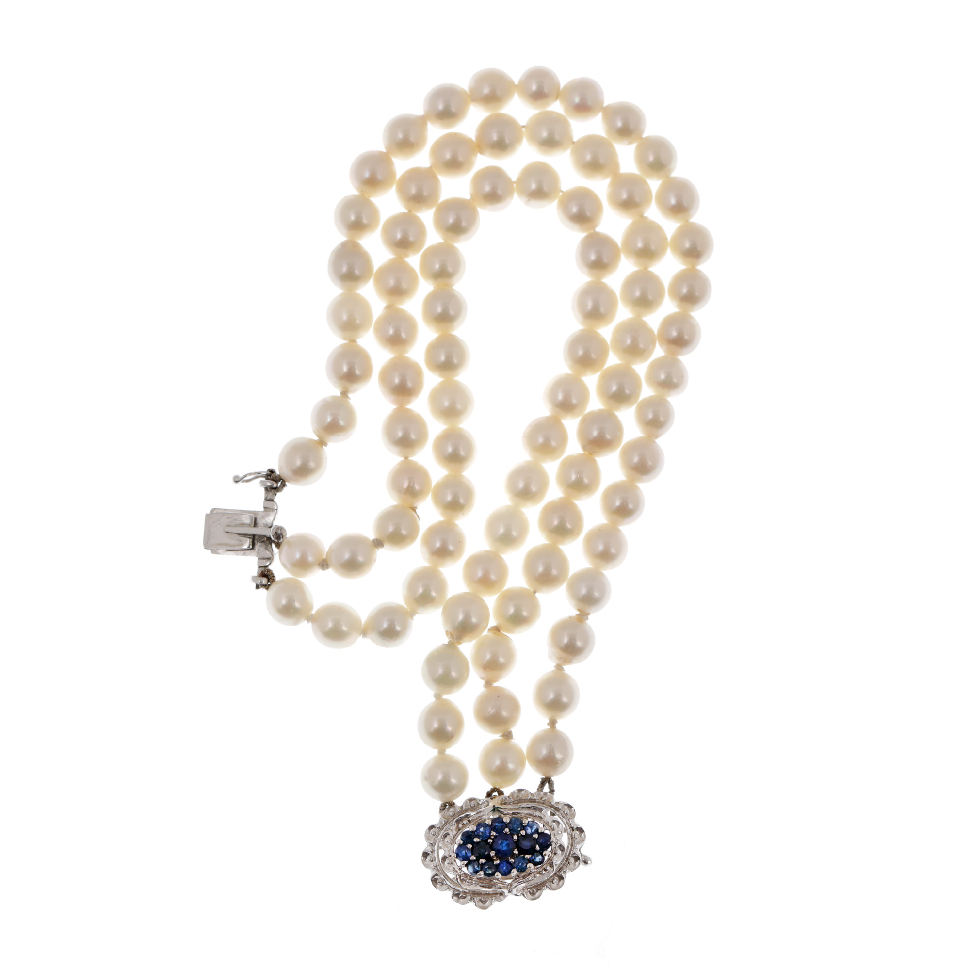 Pearl necklace with white gold clasp, adorned with sapphires and diamonds