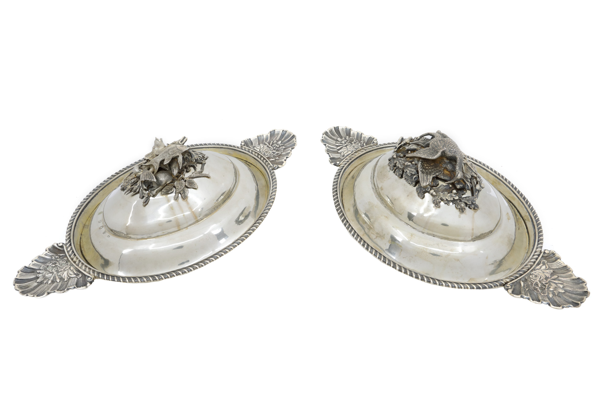 Pair of silver vegetable dishes with lids, decorated with fish and pheasants