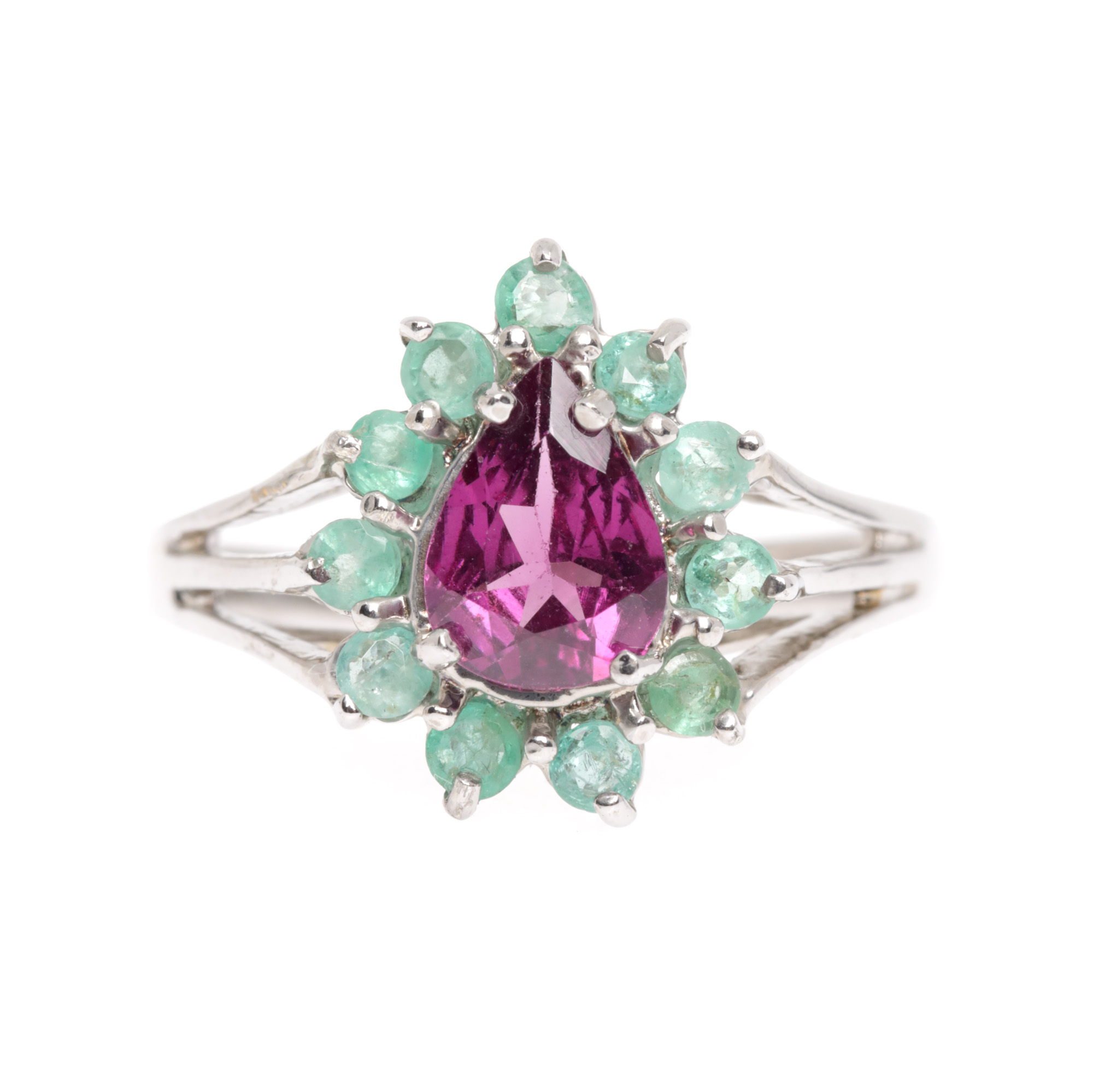 Silver ring, decorated with rhodolite garnet and emeralds