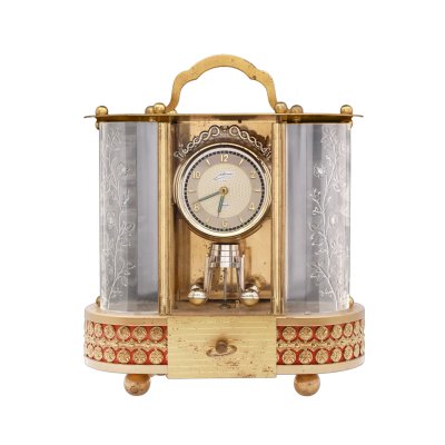 "Brahms' Lullaby" - WUA Schmid-Schlenker Desk Clock, made of brass and engraved crystal with Japanesque scenes, incorporating music box, mid 20th century, collectible piece