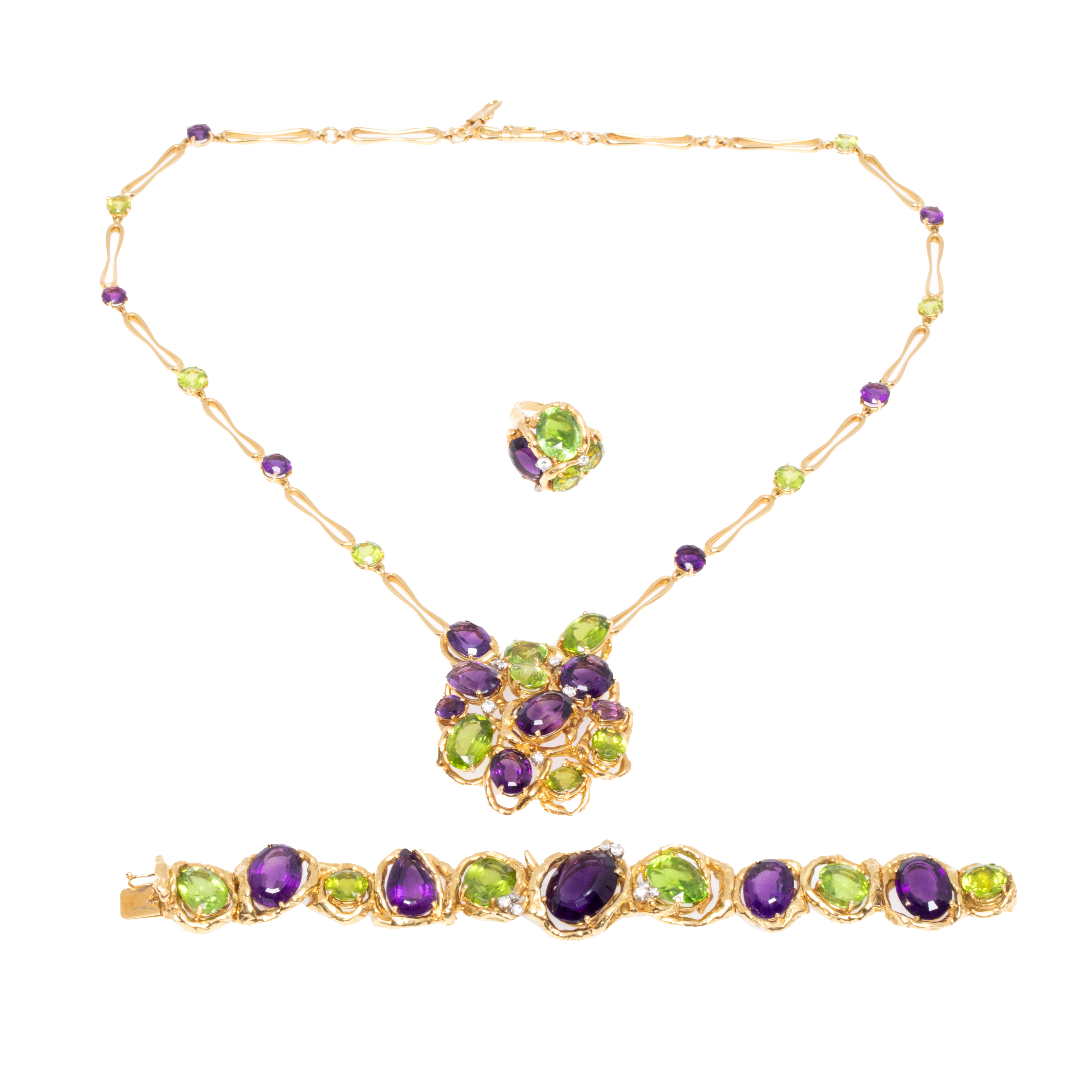 Impressive two-tone gold set, comprised of a ring, necklace and bracelet, decorated with diamonds, peridots and amethysts, signed by Julia Plana Design.