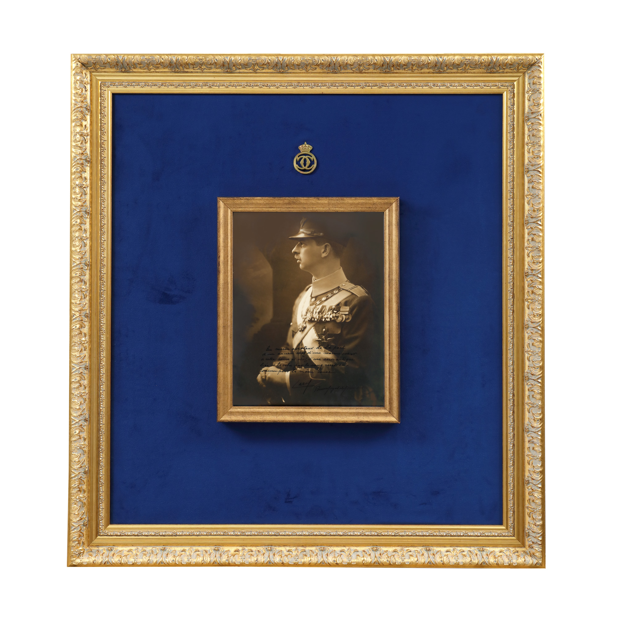 Vintage photograph, King Carol II of Romania in profile, wearing the Commander's uniform, with all received decorations including the "Carol I" order of colar, interwar period, with an extensive dedication and handwritten signature of the sovereign.