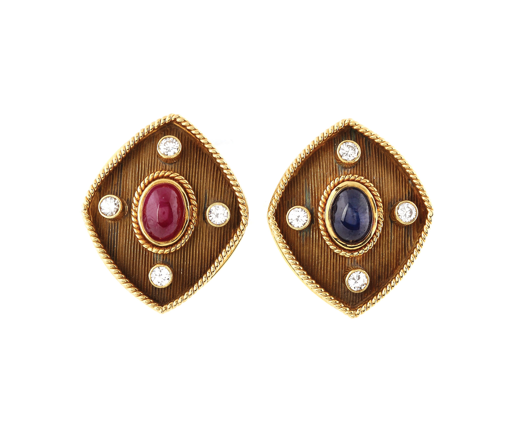 Interesting pair of gold earrings, decorated with ruby and cabochon sapphire, studded with diamonds