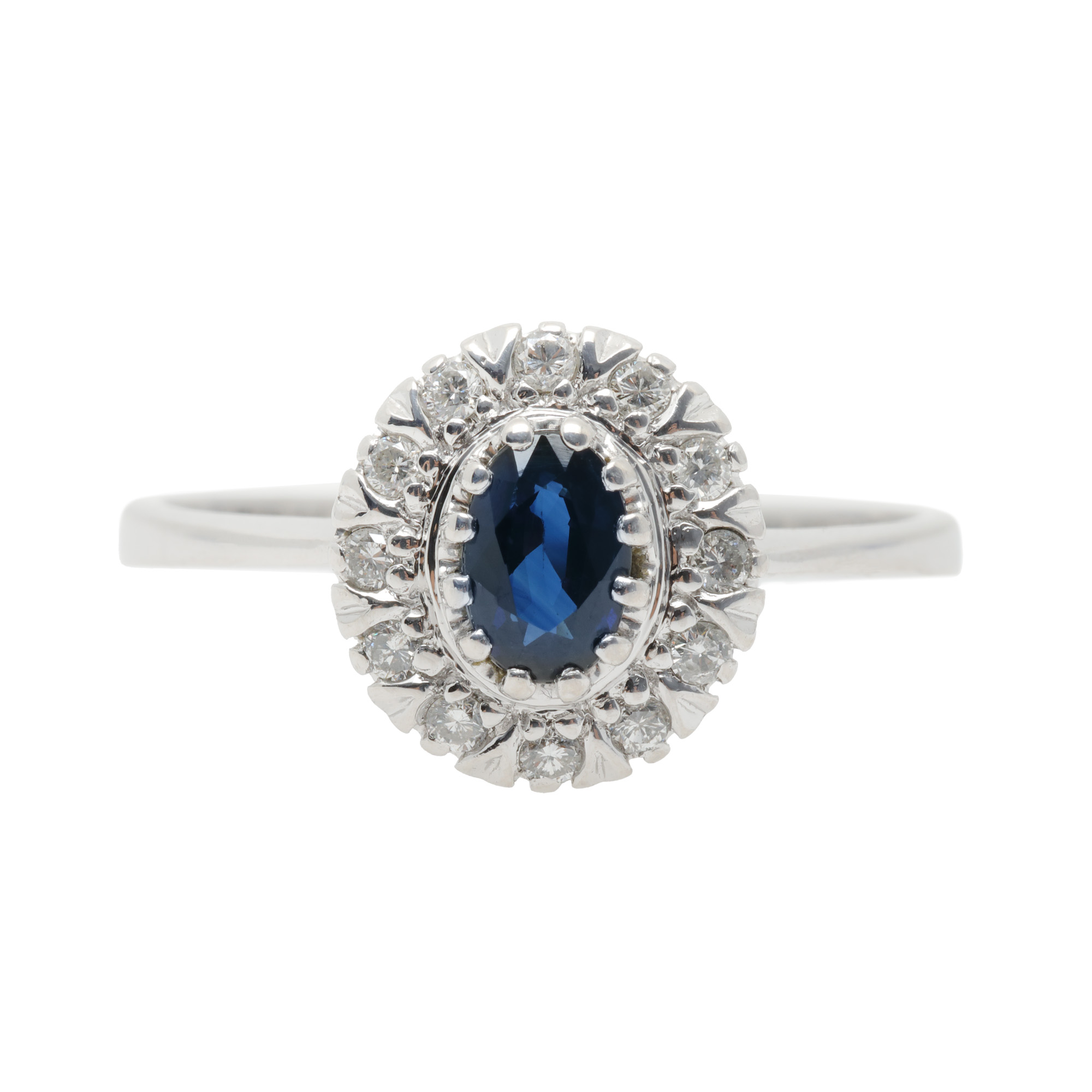 White gold ring, centrally decorated with sapphire, surrounded by diamonds