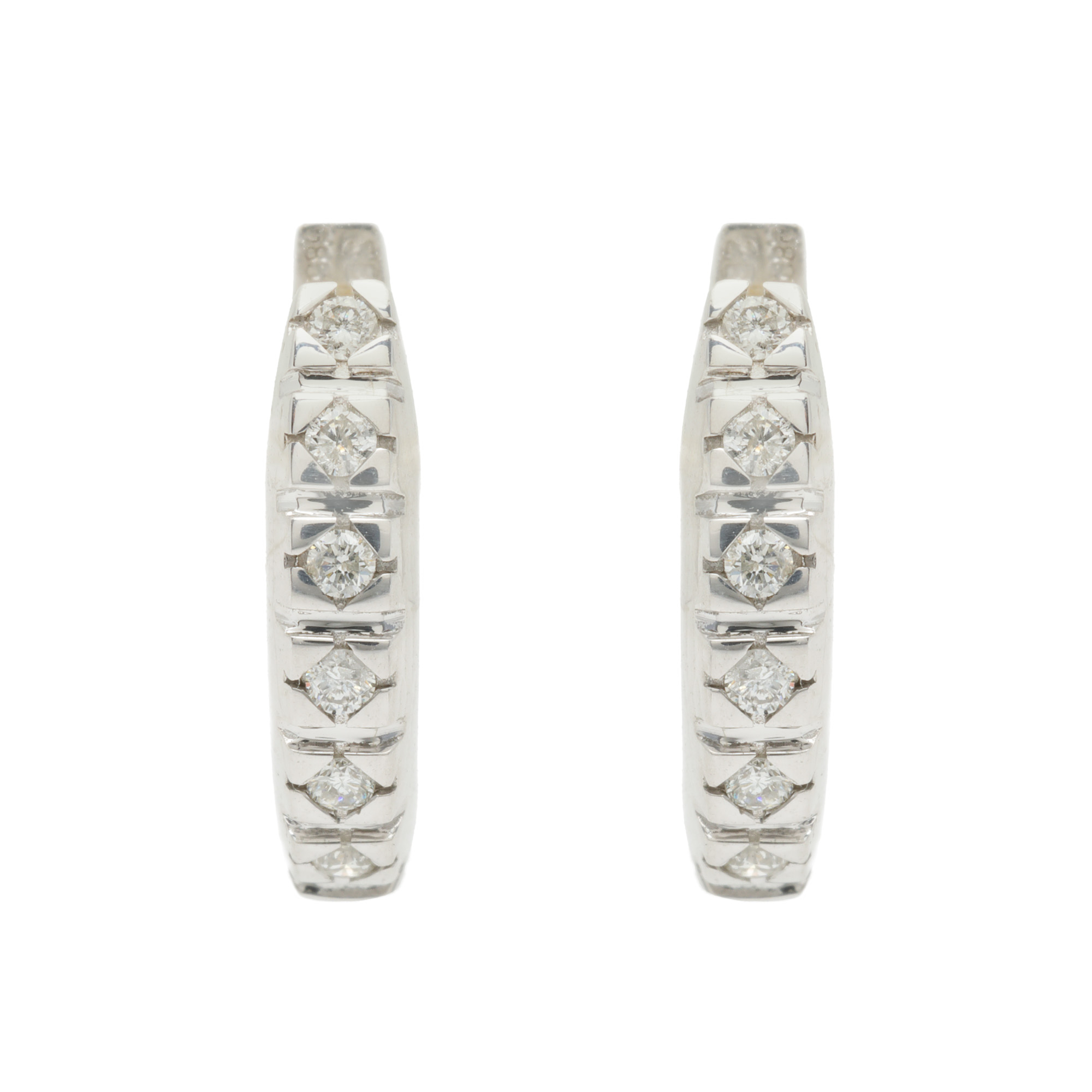 Pair of white gold earrings, decorated with diamonds