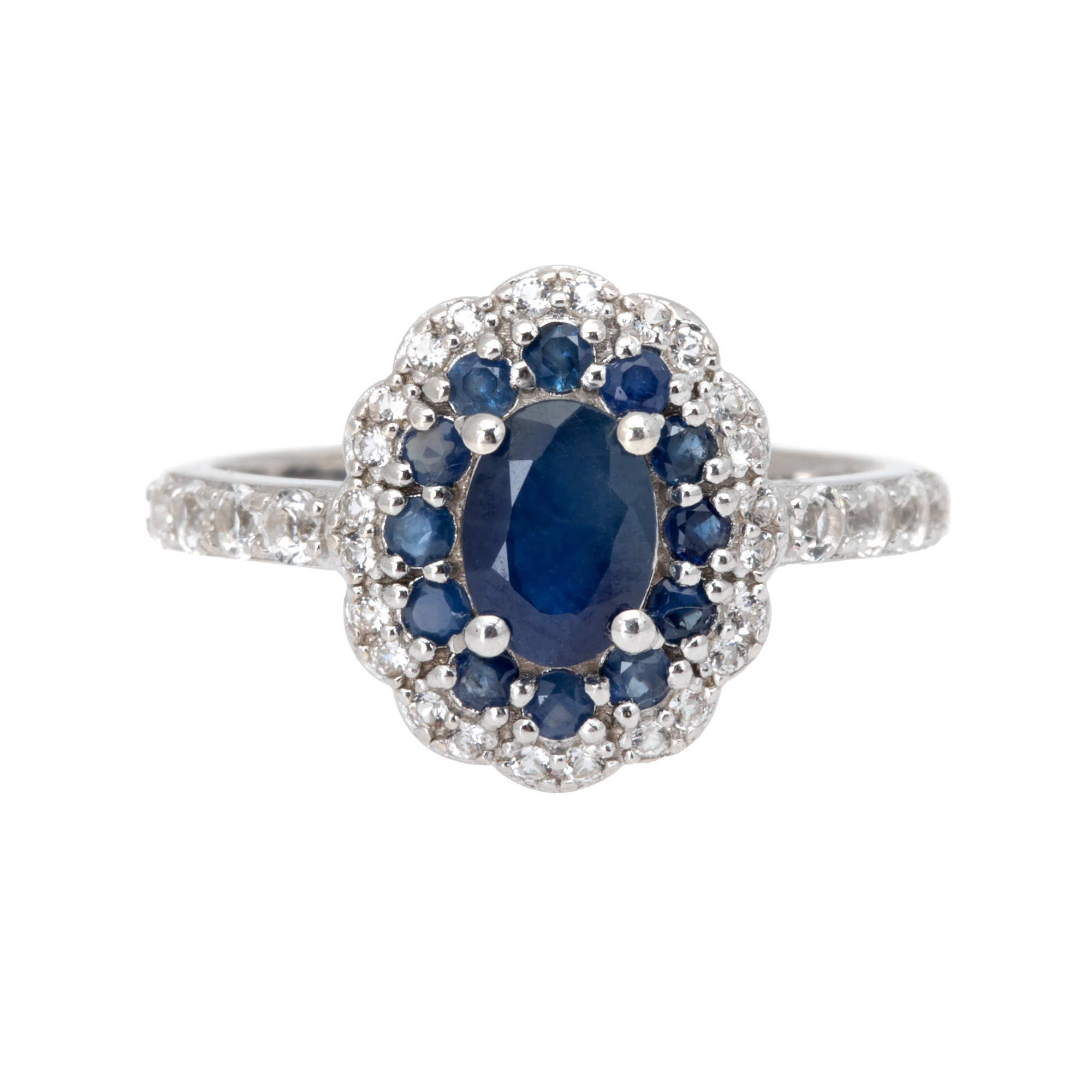 Silver ring, decorated with sapphires and topaz