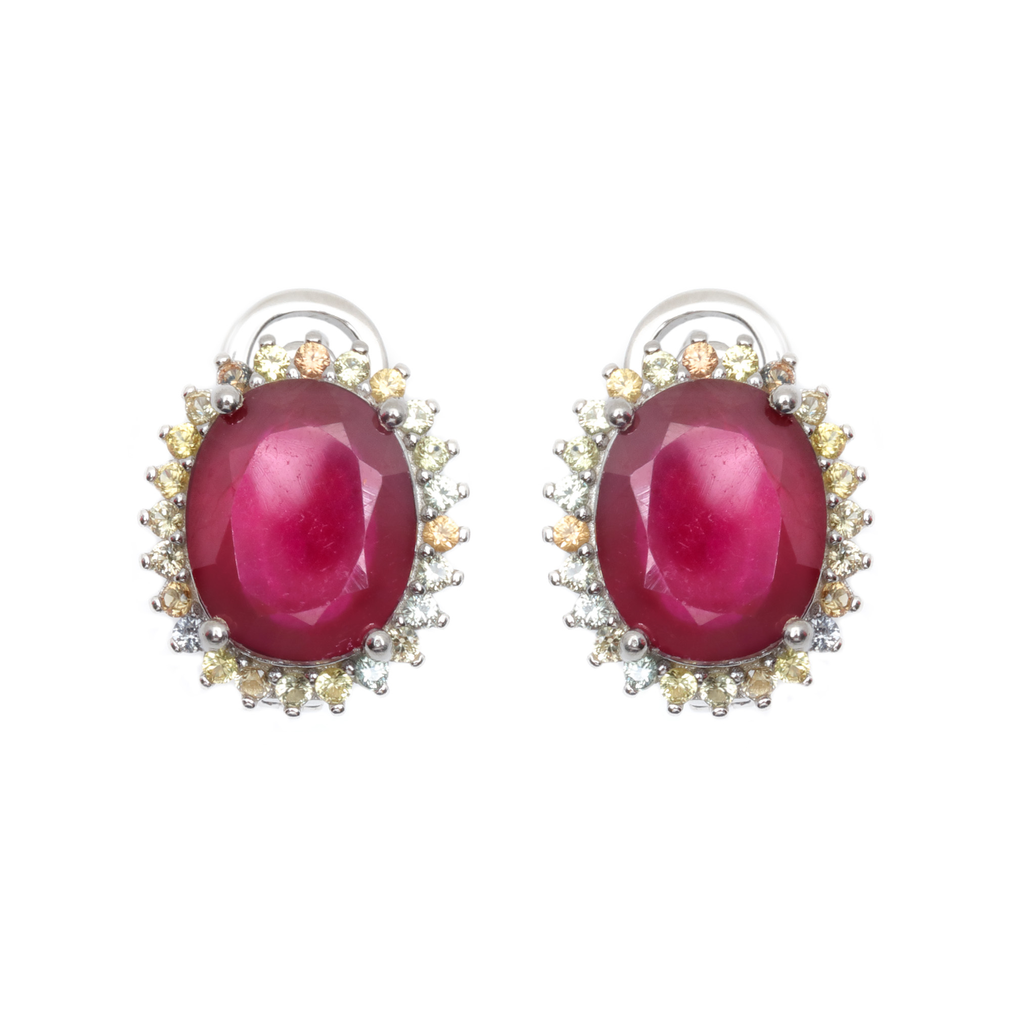 Pair of silver earrings, decorated with rubies, in a sapphire surround