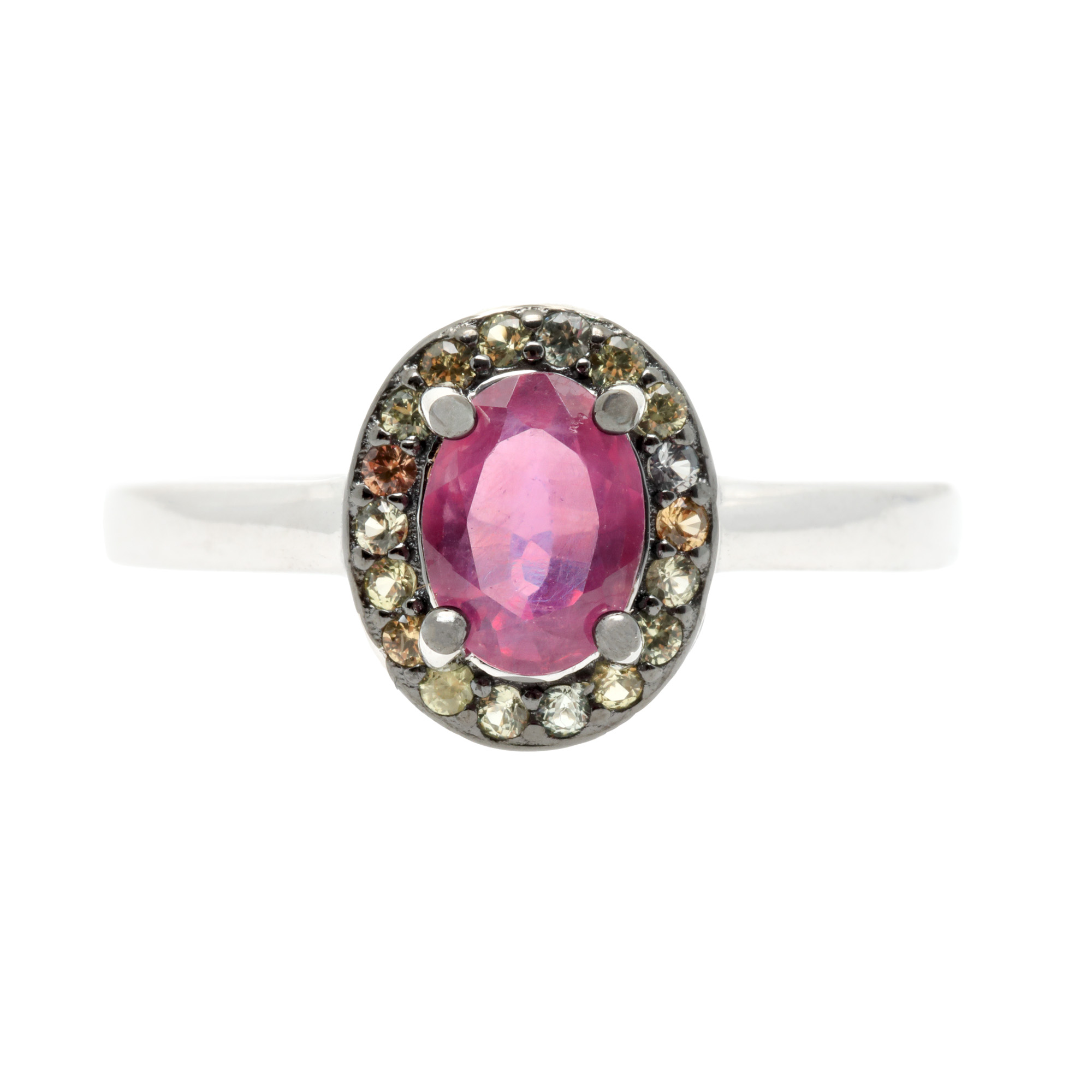 Silver ring, centrally decorated with ruby, surrounded by sapphires
