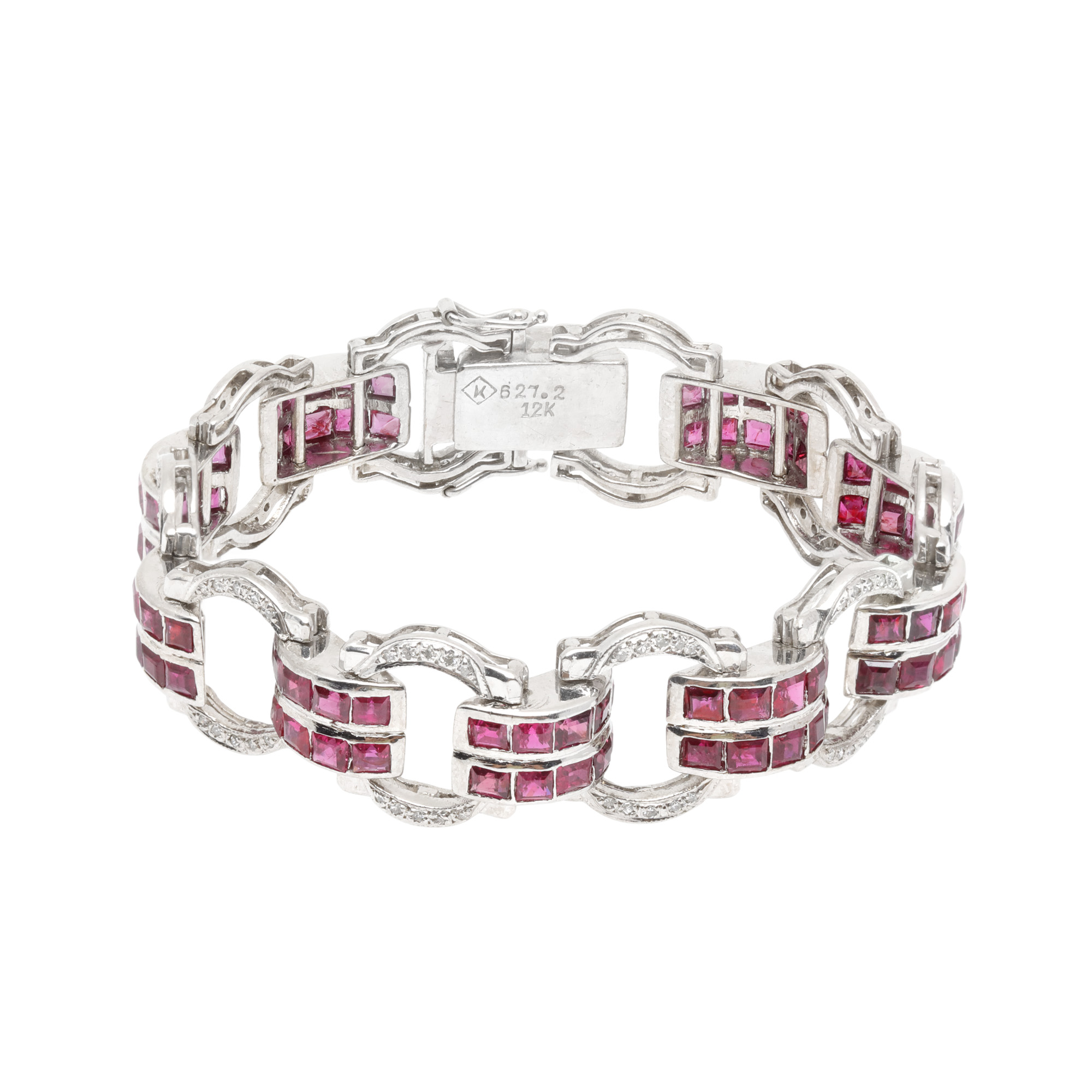 White gold set, consisting of a bracelet and a ring, decorated with alternating rubies and diamonds