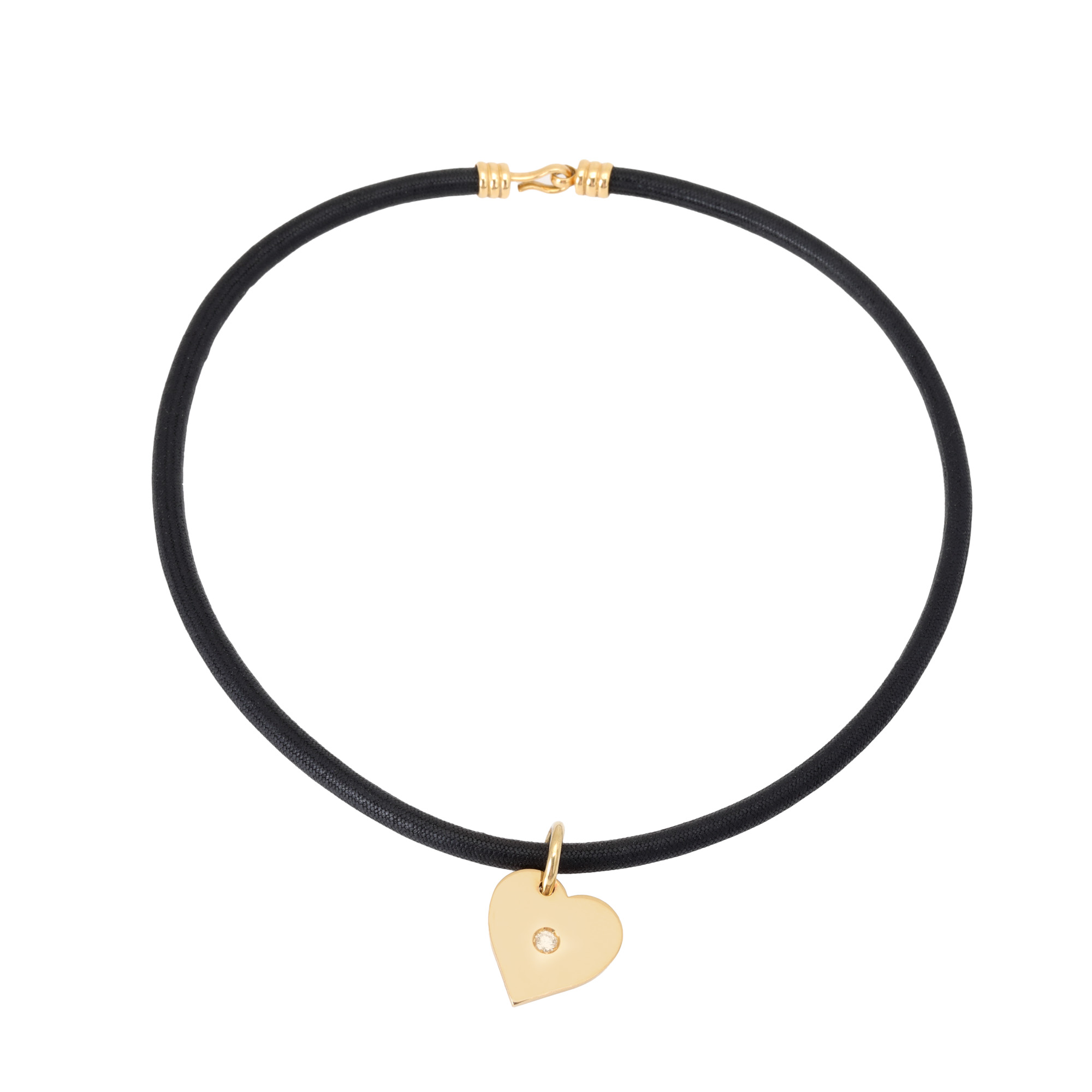 Gold necklace with a heart-shaped pendant, decorated with a diamond