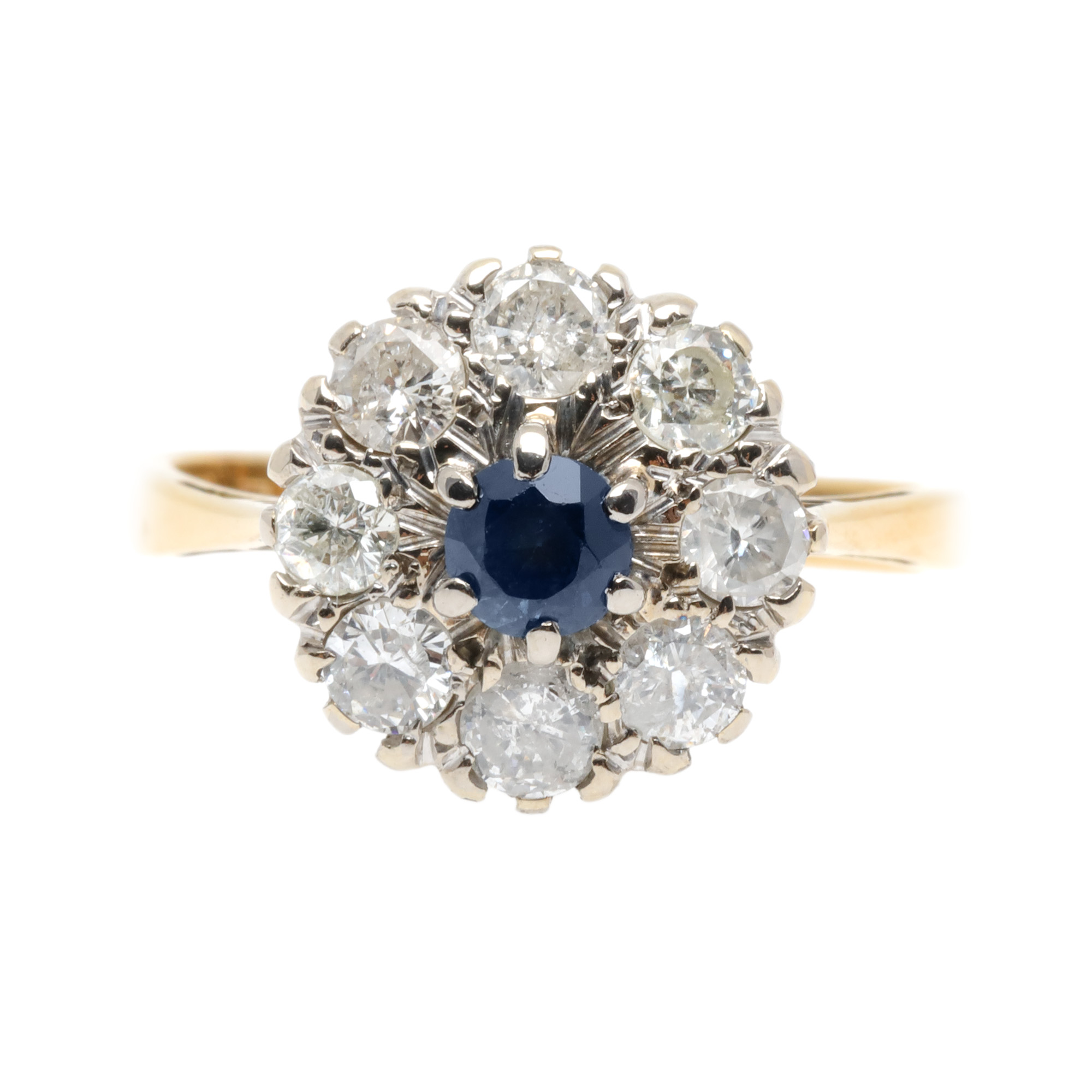 Bicolor gold ring in the form of a flower, decorated with a central sapphire, surrounded by diamonds