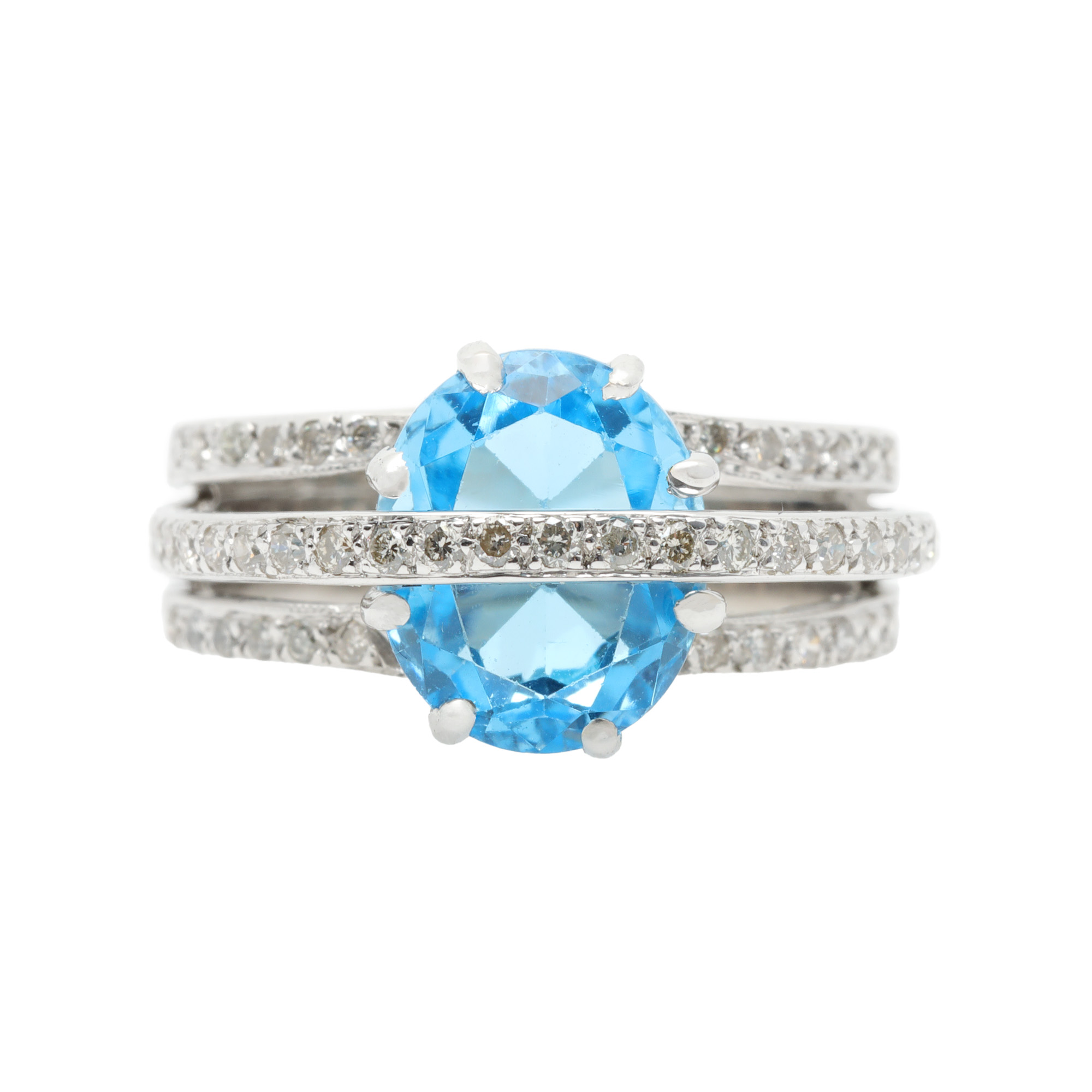 White gold ring, decorated with topaz and diamonds