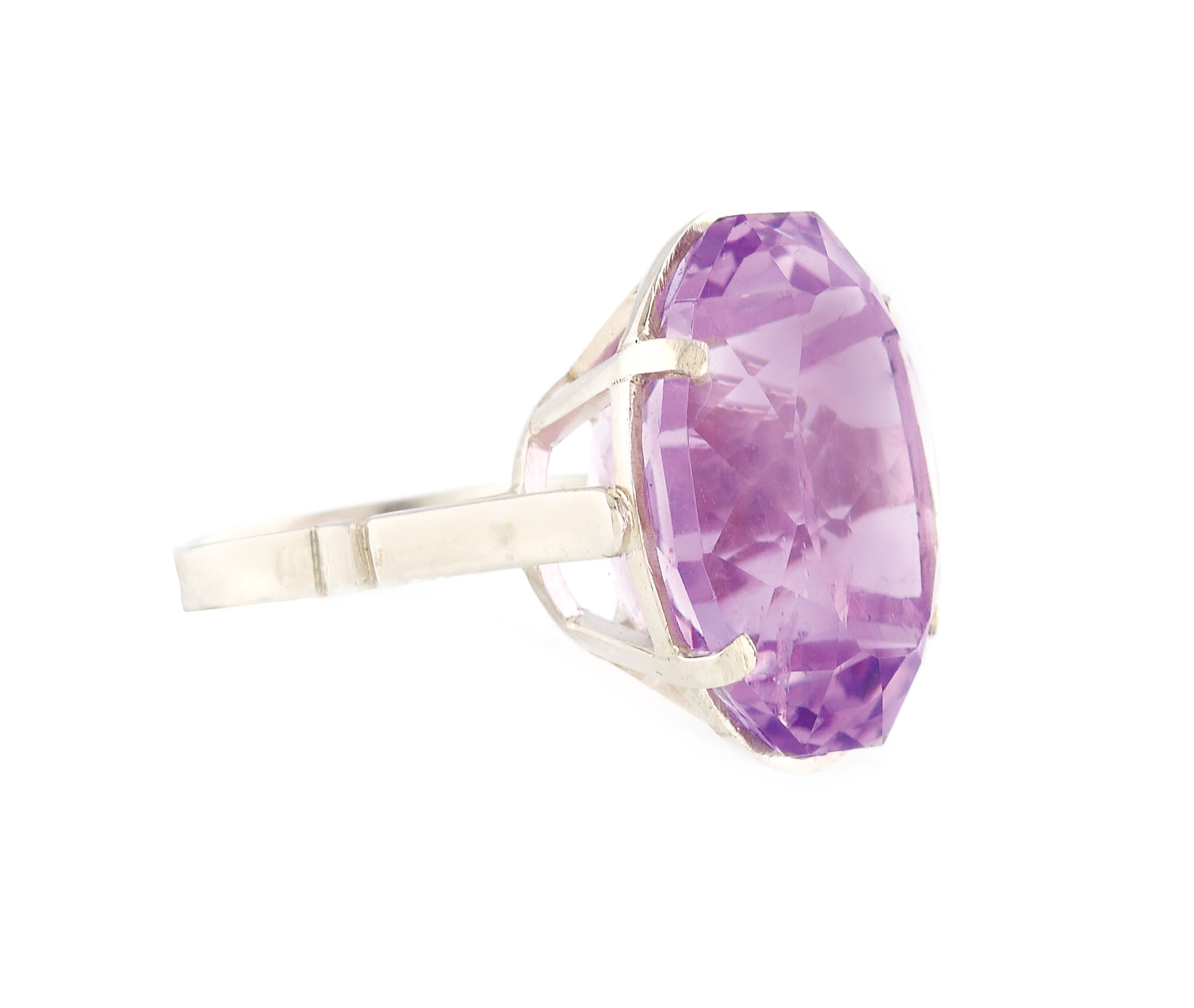Cocktail silver ring ornate with large, beautiful amethyst