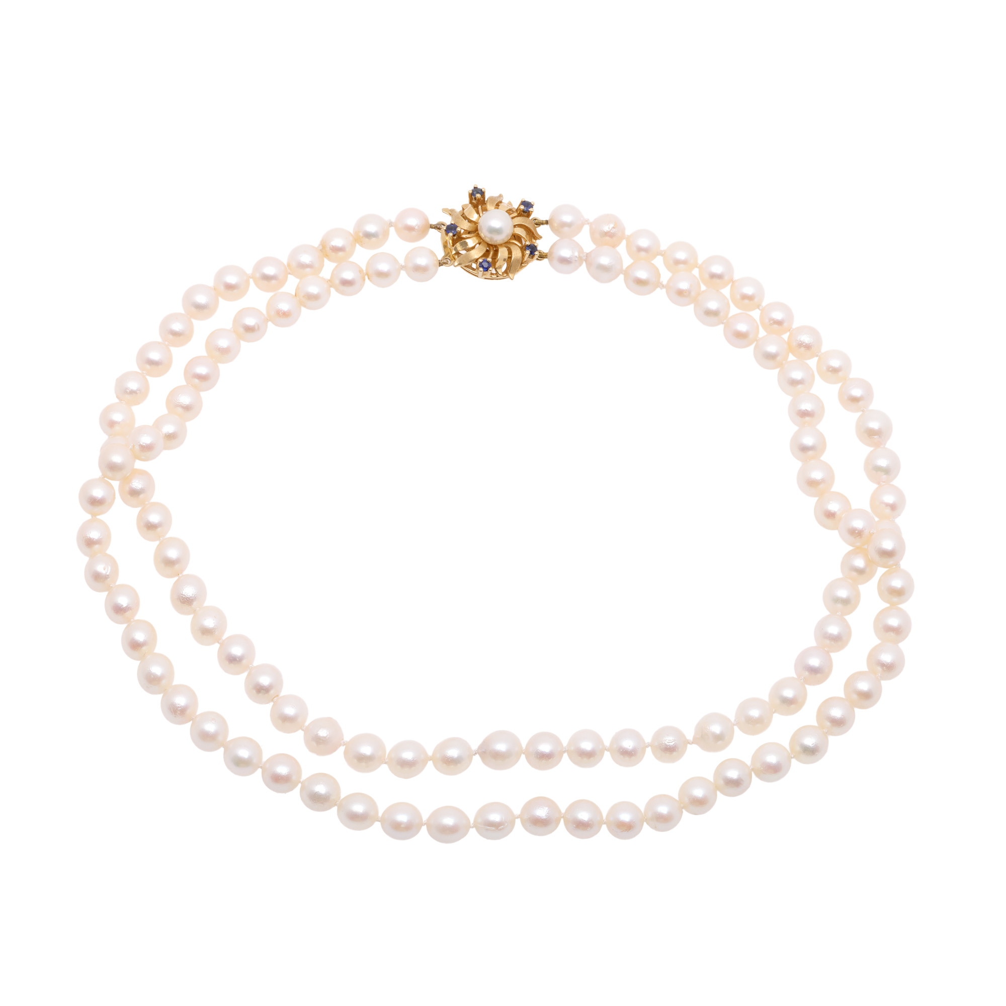 Pearl necklace, with gold clasp decorated with central Akoya pearl and sapphires