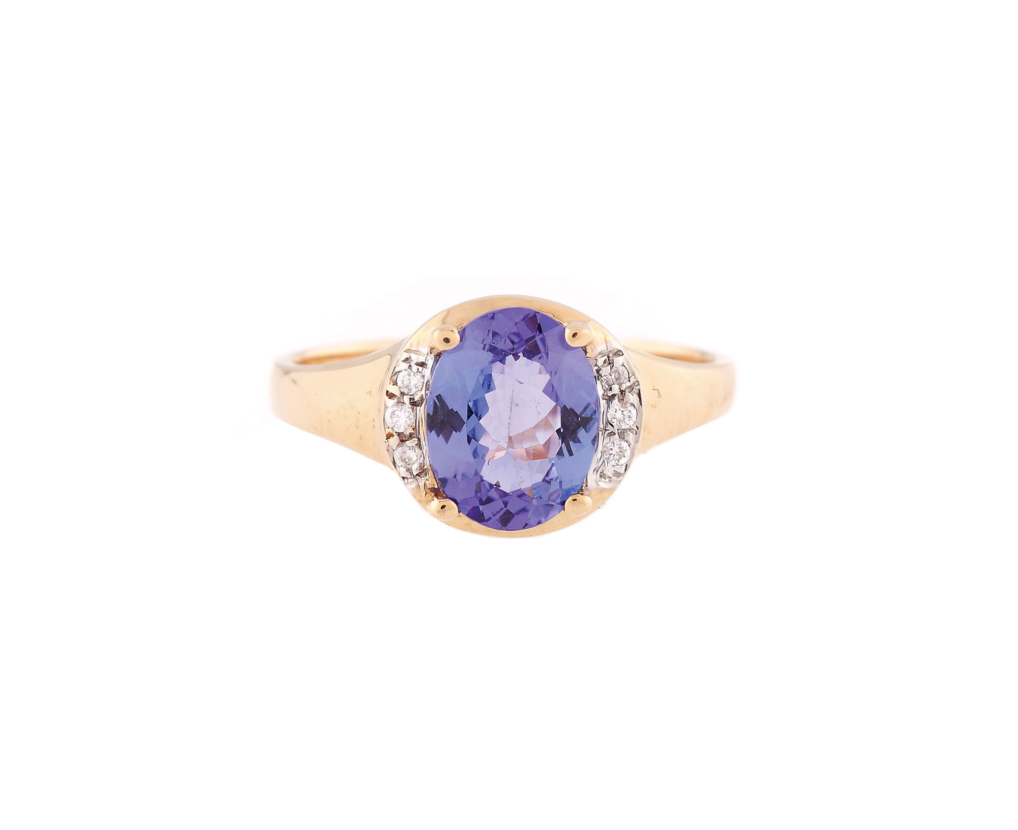 Gold ring decorated with tanzanite entoured by diamonds