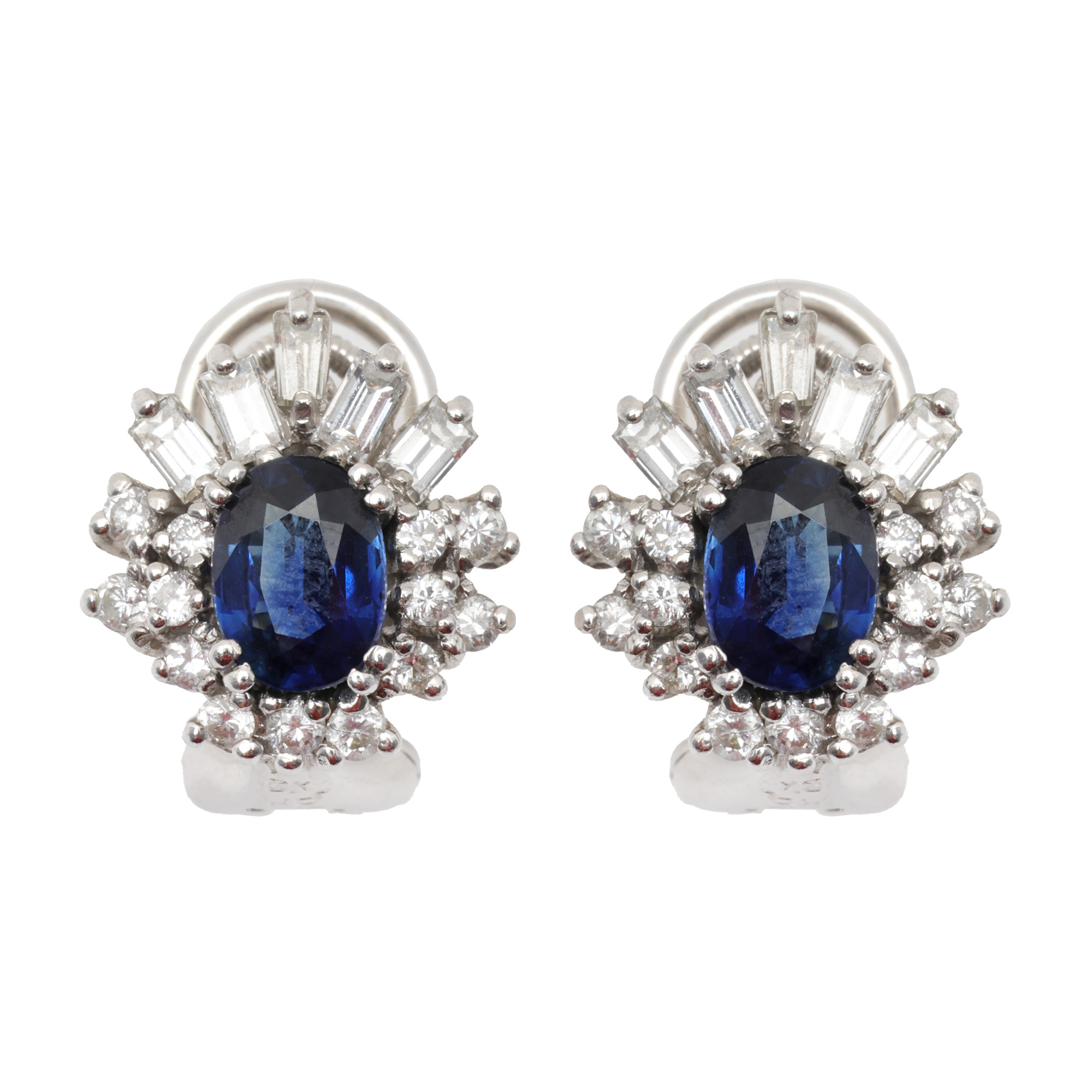 Pair of white gold earrings, decorated with central sapphires surrounded by baguette diamonds and brilliants