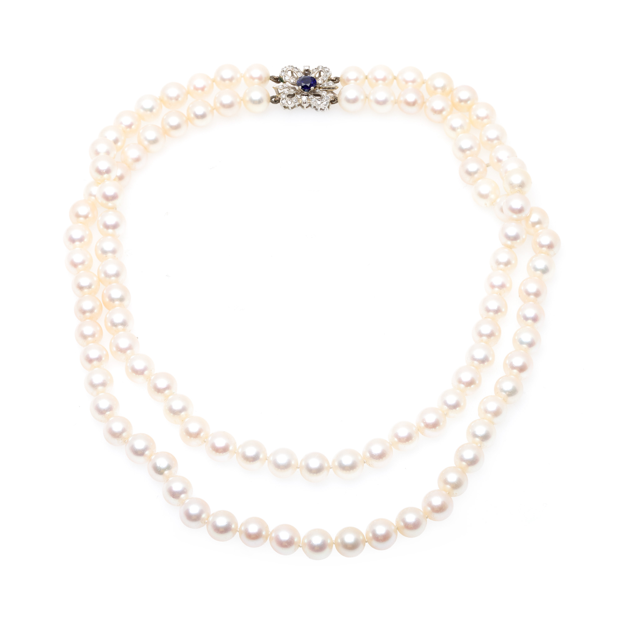 Pearl necklace with a white gold clasp, decorated with diamonds and sapphire