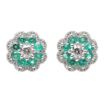 Pair of white gold earrings, in the shape of a flower, decorated with emeralds and diamonds