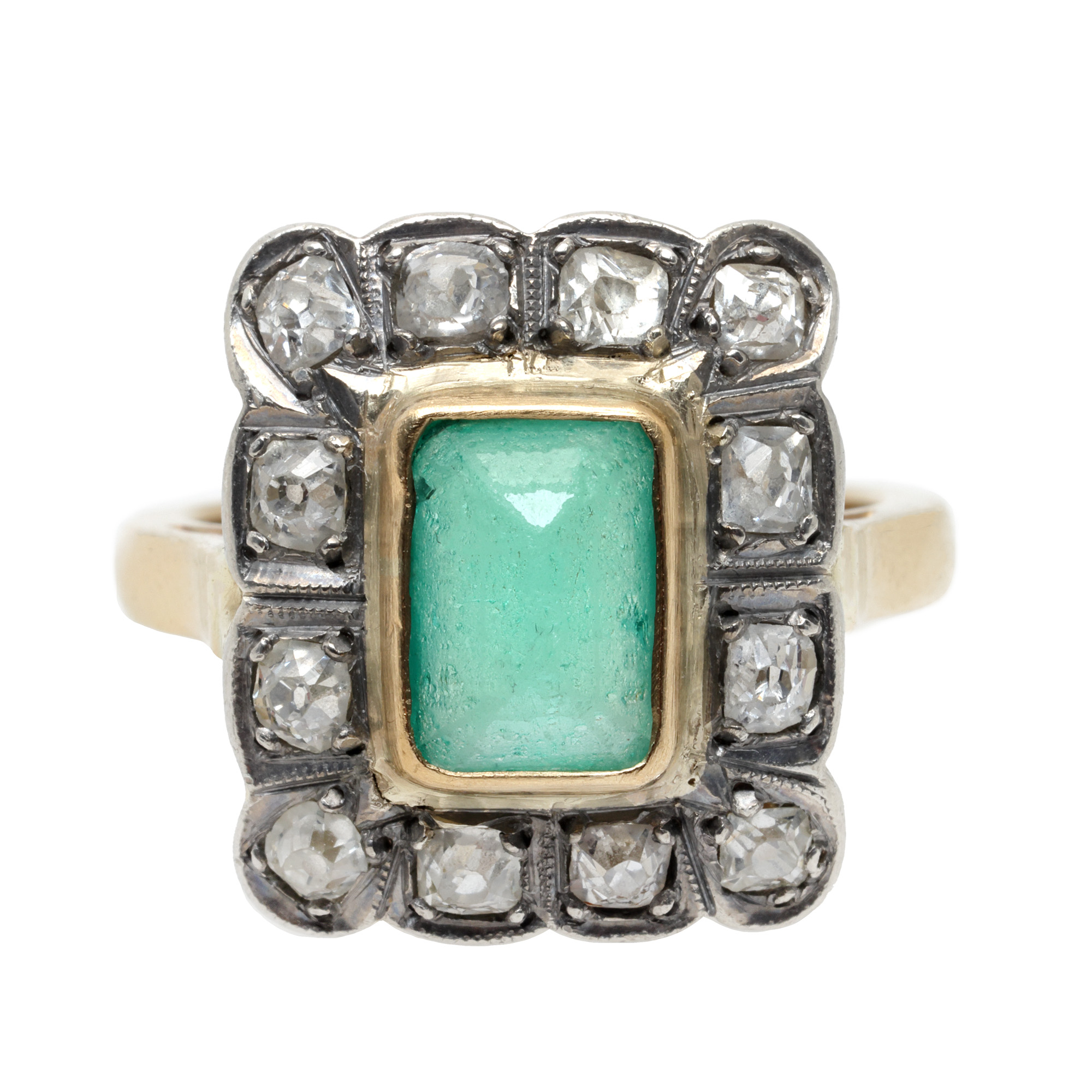 Ring in gold and silver, decorated with emerald and diamonds