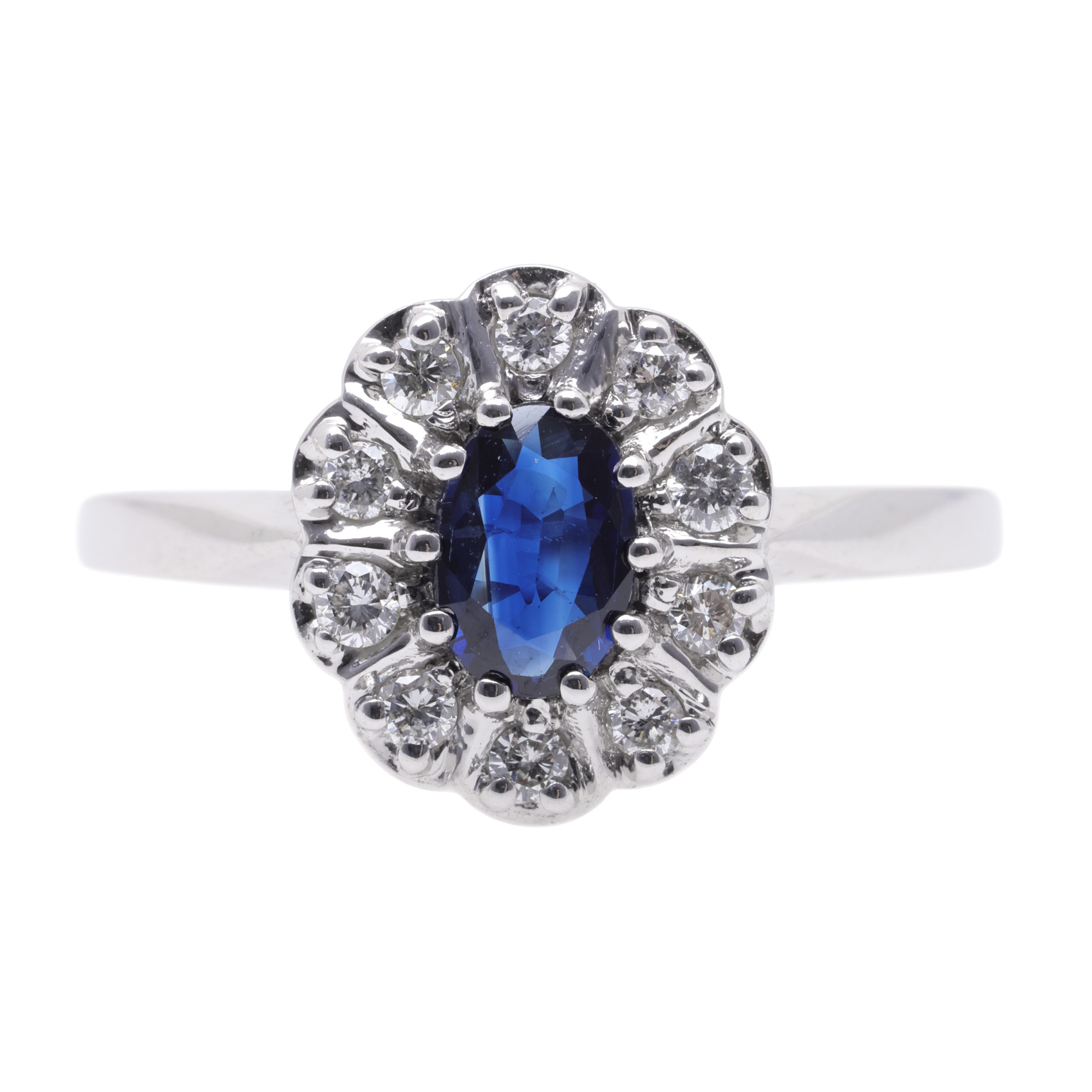 White gold ring, decorated with a sapphire surrounded by diamonds