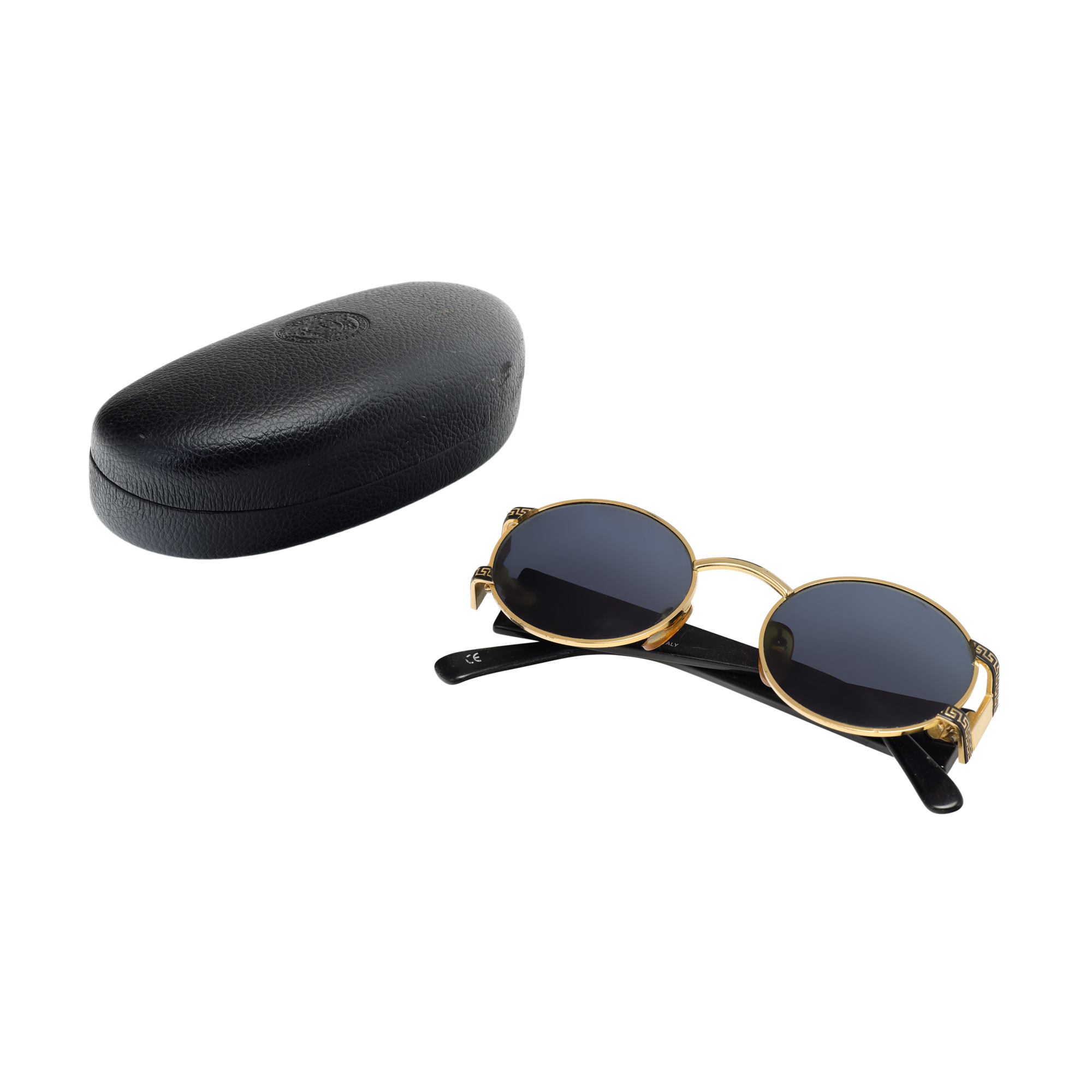 Vintage Gianni Versace sunglasses pair, decorated with Medusa head, circa 1990, accompanied by case